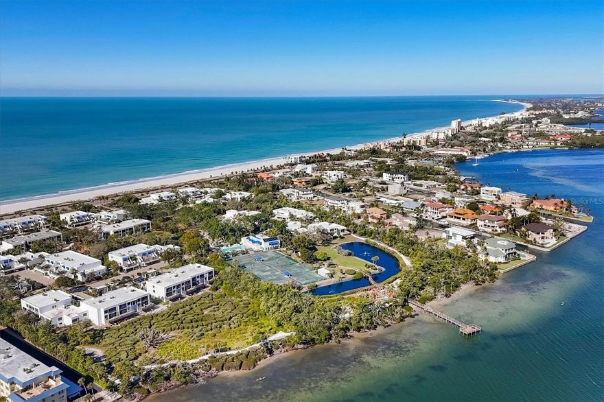 Poised within the Gulf to Bay community of Bayport Beach and Tennis Club, 842 Bayport Way offers 1570 square feet of effortless indoor-outdoor living. This first floor corner residence brings added natural light and extra privacy, giving the feeling of a private home with the ease of low maintenance living. The open layout includes a spacious kitchen, a primary bedroom with office space, walk-in closet and ensuite bath with dual vanities, as well as convenient in-unit laundry, covered parking and private storage closet. A combined dining and living area opens to a screened lanai and extended brick patio.  This is a favorite spot for morning coffee, afternoon siestas and al fresco dining watching sunset skies. A garden gate leads to a direct side path to deeded beach access across the road. For pet owners, Bayport is small-pet friendly, and this walk-out location makes dog-walking especially easy. 
 Spanning 27 acres of exquisitely landscaped tropical grounds, Bayport is celebrated for its timeless Tim Seibert architecture, exceptional amenities, and easy resort lifestyle. Residents enjoy a heated Jr. Olympic pool, clubhouse, fitness center, tennis, bocce ball, and shelled walking paths. Along the bay shoreline, a fishing pier, kayak launch and storage is perfect for morning paddles or simply enjoying nature . On the Gulf side, 1,200 feet of deeded beach access, complete with loungers and umbrellas, makes enjoying Longboat Key’s famously uncrowded beaches effortless. 
The condo’s split floor plan works well for year round living or a seaside escape. A favorable rental policy offers excellent income opportunity.  Located mid-key, Bayport keeps you close to shopping, daily conveniences, great island dining, and the vibrance of Sarasota, all while feeling tucked away and serene. Settle in and enjoy a slice of true paradise on Longboat Key.