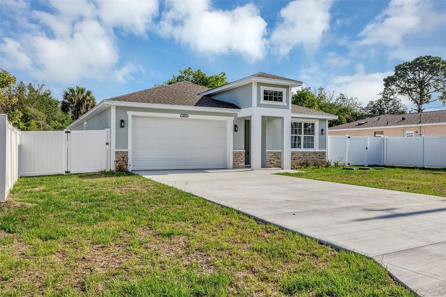 This move-in ready new construction home offers modern design and high-quality finishes throughout. Featuring 4 bedrooms and 3 full bathrooms, the layout is thoughtfully designed for both comfort and functionality.
Upon entry, you’re welcomed by an elegant glass front door and impressive high ceilings that create a bright and open feel. Tile flooring runs throughout the home, adding both style and durability. The split floor plan provides privacy and flexibility. On one side, you’ll find two well-sized bedrooms sharing a full bathroom with granite countertops. On the opposite side, an additional spacious bedroom includes its own en-suite bathroom with a beautifully finished shower. The heart of the home is the expansive kitchen, complete with stunning granite countertops, abundant cabinetry with crown molding, and a large, eye-catching island—perfect for cooking and entertaining. The open-concept design flows seamlessly into the dining and living areas, offering plenty of space for gatherings.
The primary suite is generously sized and features a large walk-in closet. The en-suite bathroom includes dual sinks and an oversized shower with elegant finishes. Step outside to a covered back porch overlooking a fully fenced yard, providing privacy and a great space to relax or entertain. Conveniently located near The Villages, with easy access to hospitals, shopping, and dining, this home offers both comfort and an excellent location. Builder is offering up to $10,000 toward closing costs, adding even more value to this exceptional property. Homes offering this combination of style, space, and location are in high demand schedule your showing today!!