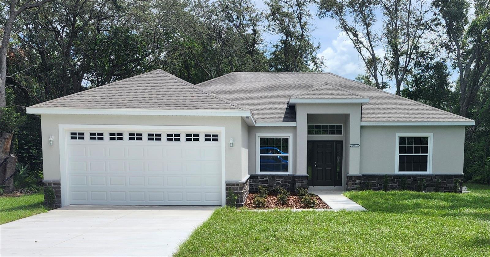 Under Construction. New Construction 4/2 Home is still under construction and should be completed late October 2025. NO HOA - PLUS A HUGE 1600sf WORKSHOP/STORAGE BUILDING with this .728 acre Oversized Lot. The neutral tone finishes and the luxury vinyl plank flooring throughout the home will provide a perfect backdrop for any Buyer's design style. The great room in the heart of the home, is open to the kitchen, providing a very spacious and airy feel. The kitchen boasts granite countertops, a stainless-steel appliance package and an eat-in dinette area. The master bedroom is generously sized and features a walk-in closet and an ensuite bathroom with beautiful tile work in the walk-in shower. The 4th bedroom is perfectly situated to serve as flex space/office space. The exterior ledge stone gives this home wonderful curb appeal. Floor plan and site plan available for viewing. A must-see home!!!***PLEASE NOTE that photos in listing are renderings and not site specific*** Photos will be updated once construction is complete.
PUBLIC BOATRAMP & DOCK is only a few blocks walking distance from the home, so store your boat in your storage building and enjoy the Lake Harris Chain of Lakes whenever you want!