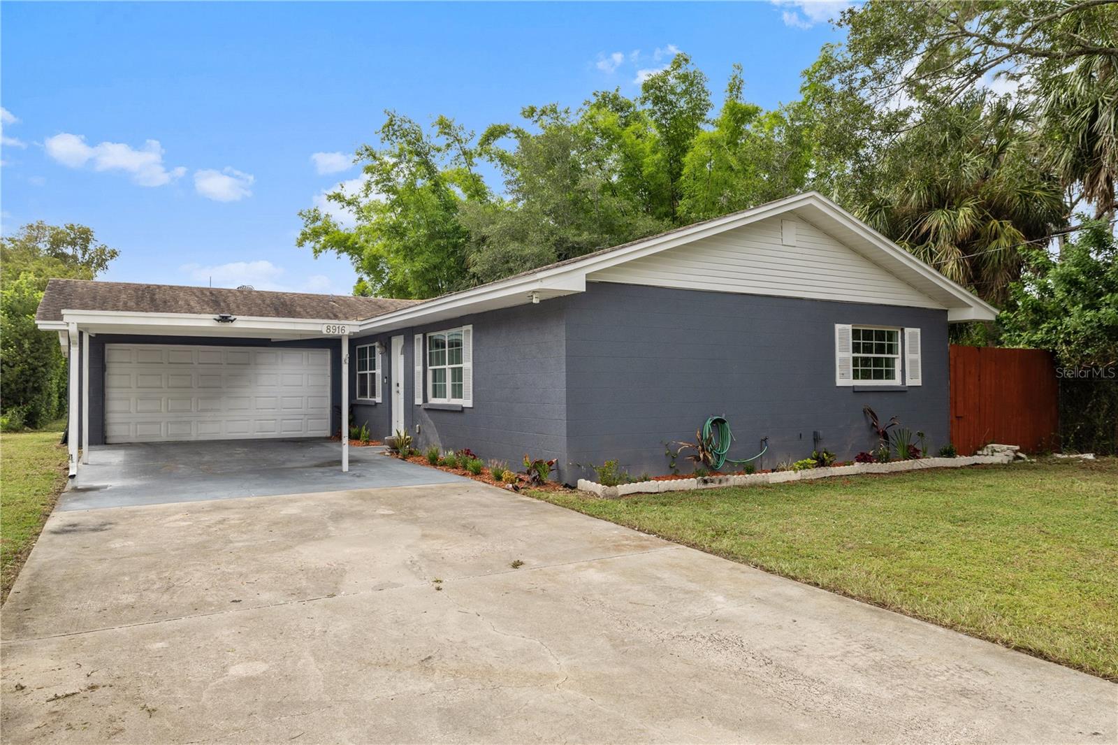 Beautifully updated home on a ¼-acre saltwater canal lot with a private dock and boat ramp! This light-filled home offers an open floor plan with luxury vinyl throughout, a spacious, newly remodeled kitchen featuring ample cabinet space, quartz countertops, new stainless steel appliances, tiled backsplash, and water views. Both bathrooms have been fully renovated with tiled showers, glass doors, and modern finishes, including a lighted mirror in the primary suite. Enjoy a large walk-in closet in both bedrooms, a two-car garage with front and rear doors allowing easy access for boat storage, and a rear patio with pergola perfect for entertaining and enjoying the water views. The property is adjacent to a peaceful conservation area for added privacy and can be seen from multiple windows. New AC installed in 2023.