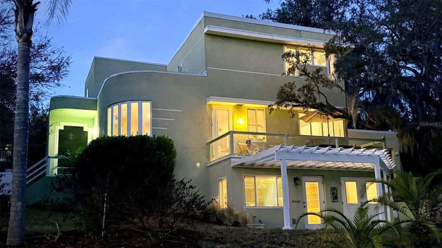 Magnificent Mid-Century Masterpiece First time on the market. This 4 bed/3.5 bath custom home was built in 1998 and exudes deco style while embracing modern day lifestyles. The Owners' helped design this quality built home to showcase the panoramic elevated views of aptly named Crystal Lake. Buyers will experience the indoor/outdoor harmony they envisioned from every room. Whether you are hanging out in the sunken family room with built-in seating/entertainment center,  gathering by the wood burning fireplaces in the spacious living room and dining room, or lounging on the screened lanai, open deck, or under the pergola covered patio; relaxing lake views abound. Beautifully appointed with hand-crafted features including custom cabinetry, built-in bookcases and window seats, vintage lighting, interior entry water-feature and period inspired stairwell. The walk-out basement features custom built-ins with murphy bed/entertainment center /work station which converts easily into a perfect in-law quarters or 4th bedroom and sports a full bath and private entrance. Basement also houses a separate in-home office area with outside private entrance. Additionally the home includes a storage shed, RV pad with electric, and oversized two car carport with storage closets. Moments from historic downtown Clermont's thriving entertainment, dining, shopping district, Lake Minneola beachfront park, cross-county bike trail and the newly opened Aurelia Cole K-8 school. Recent updates include new roof (2025) and upstairs HVAC (2026). Want even more room? Adjacent buildable lot available with home sale for additional cost. Homes like this do not come on the market often, call today