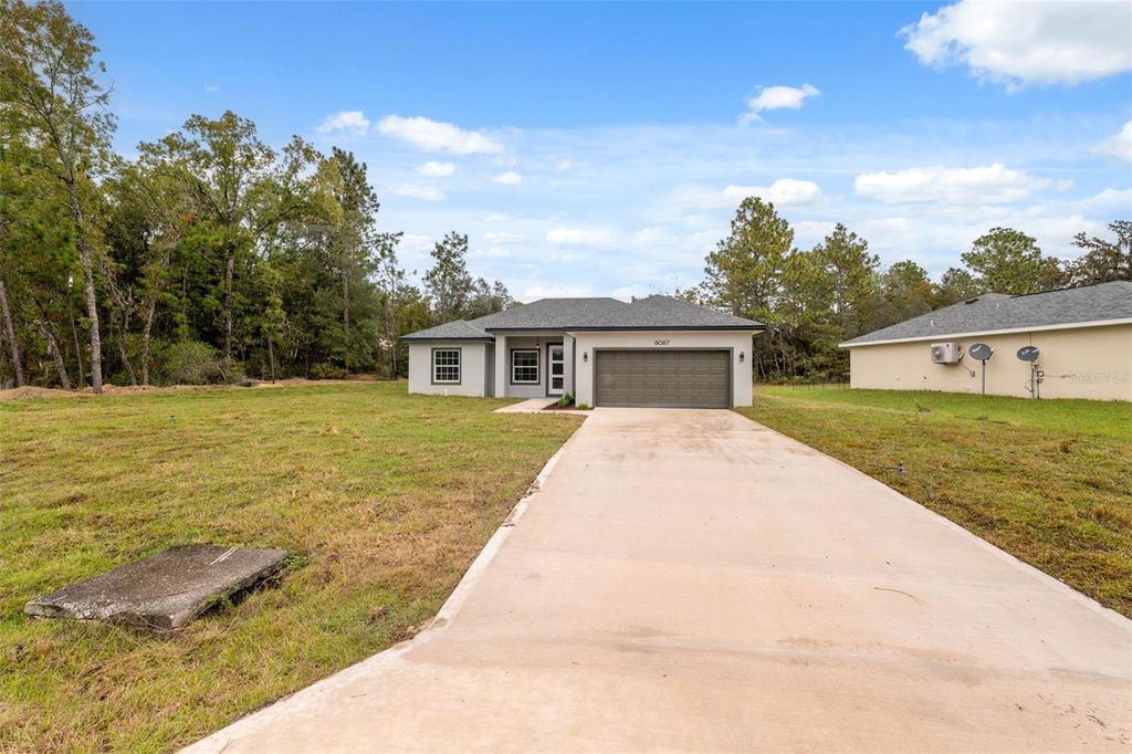 Photo of 6067 SW 155th Street Road, Ocala, FL 34473 (MLS # O6359626)