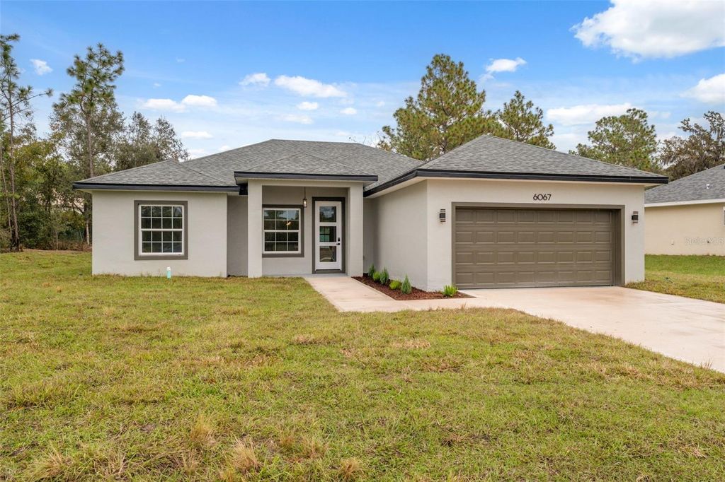 Photo of 6067 SW 155th Street Road, Ocala, FL 34473 (MLS # O6359626)