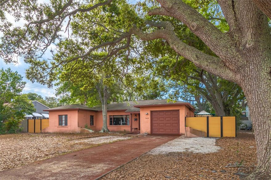 Discover a truly unique property in the highly sought-after Tyrone/Jungle Terrace neighborhood, set on a spacious ¼-acre lot and positioned high and dry (Flood zone D). This home offers not only character and charm, but also versatility and income potential. A separate living dwelling that includes it’s own private entrance, bathroom, and kitchenette. Excellent for rental income, guest accommodations, or multigenerational living.
The main home is constructed of solid concrete block and features expansive windows that fill the space with natural light. Inside, you’ll find a functional layout. Main structure includes attached garage, dedicated laundry area, 2 bedrooms, 1 bathroom and a bonus room currently used as a media room.
One of the standout features of this property is the detached rear garage space, thoughtfully designed as a dance studio and soundproof recording room—ideal for creatives, musicians, or those seeking a private workspace. Step outside into your own private retreat. The backyard, made for entertaining, featuring a large deck equipped with seating, dining area, and even a pizza oven. Enjoy unforgettable evenings with an outdoor movie projection setup, unwind in the hot tub, or relax on the sun loungers.
The property also offers: Alley access with an automatic gate. Parking for multiple vehicles, including space for an RV or boat. All that and still plenty of yard space, perfect for pets or outdoor activities. A large storage shed for added convenience.
Ideally located just minutes from the beaches, shopping, dining, and conveniences of the Tyrone area, this property combines lifestyle, location, and opportunity.
A truly one-of-a-kind property ready to be elevated into something extraordinary!