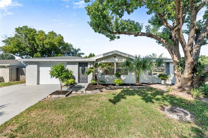 Florida lifestyle at its best! Welcome to your 4 bedroom, 2.5 bathroom sparkling pool home with screen enclosed lanai. Non-flood zone and no HOA fees or restrictions. This rare gem is a totally renovated 1862sf home with new kitchen cabinets & appliances, including glass-top range and refrigerator with ice and water in the door. All new bathrooms. New AC and hot water heater plus updated electric breaker panel box. Roof is only 8 years old. Washer /dry hook-up in attached garage. All new luxury vinyl plank flooring & 5” baseboards throughout. Fresh paint inside and out. The spacious primary bedroom offers a large walk-in closet and an ensuite bathroom featuring a tub-shower combo and dual vanities. The three guest bedrooms are the perfect size for a growing family or lots of grand children. This beautiful home is centrally located and extremely close to shopping, public transportation, and the Gulf of Mexico. Just 35 minuted to Tampa International Airport via the Suncoast Parkway.