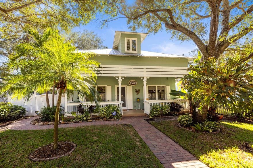 Key West–inspired conch-style elegance meets timeless historic charm in the heart of Downtown Dunedin at 637 Scotland Street. Located on one of the area’s iconic brick-lined streets within the Historic Downtown District, this extraordinary home offers 3 bedrooms, 3 full bathrooms, and over 3,200 square feet of heated living space—a rare combination of character, space, and walkability.

Lovingly owned by the same family for over 25 years and fully restored with exceptional care, this home blends early-1900s craftsmanship with thoughtful modern updates while preserving its vintage soul. From the moment you arrive, the white picket fence, mature tropical landscaping, and charming walkway invite you onto a storybook front porch with soaring ceilings, setting the tone for what lies inside.

Step into a warm and inviting living space featuring refinished wood floors throughout, custom built-in cabinetry, and architectural details that tell a story at every turn. The primary suite on the main level offers a spacious bedroom and a large en-suite bath, creating a private and comfortable retreat.

The kitchen is truly one of a kind, featuring rare vintage soapstone countertops, custom cabinetry, and gas appliances—perfectly blending Key West flair with historic elegance. Crown molding, oversized baseboards, and preserved accents maintain the authentic character of this early-1900s gem.

The home continues to impress with a charming dining area and an expansive open loft upstairs, ideal as a movie room, entertainment space, or flex living area, complete with an additional bedroom and full bathroom. A walk-in attic provides generous storage, adding both convenience and function.

Step outside and discover a backyard unlike any other. The property is home to a published backyard railway, featured on the 2014 National Backyard Railway Tour—a truly rare and celebrated highlight that adds to this home’s one-of-a-kind story. Paver pathways, a private patio, outdoor entertaining spaces, and lush tropical landscaping create a magical setting, with a hot tub tucked along the side of the home for relaxing evenings under the stars.

Additional features include alley access, a detached garage, off-street parking, and covered golf cart parking, making downtown living effortless. Major updates include a metal roof (2004) and a new A/C system installed in 2022.

And best of all—you’re just steps from everything Downtown Dunedin has to offer. Walk, bike, or take your golf cart to restaurants, shops, breweries, festivals, the waterfront, and the Pinellas Trail.

More than a home—this is a Key West–inspired lifestyle wrapped in historic charm, in one of the most desirable locations in Dunedin.

Schedule your private showing today—because a home this special rarely comes to market.