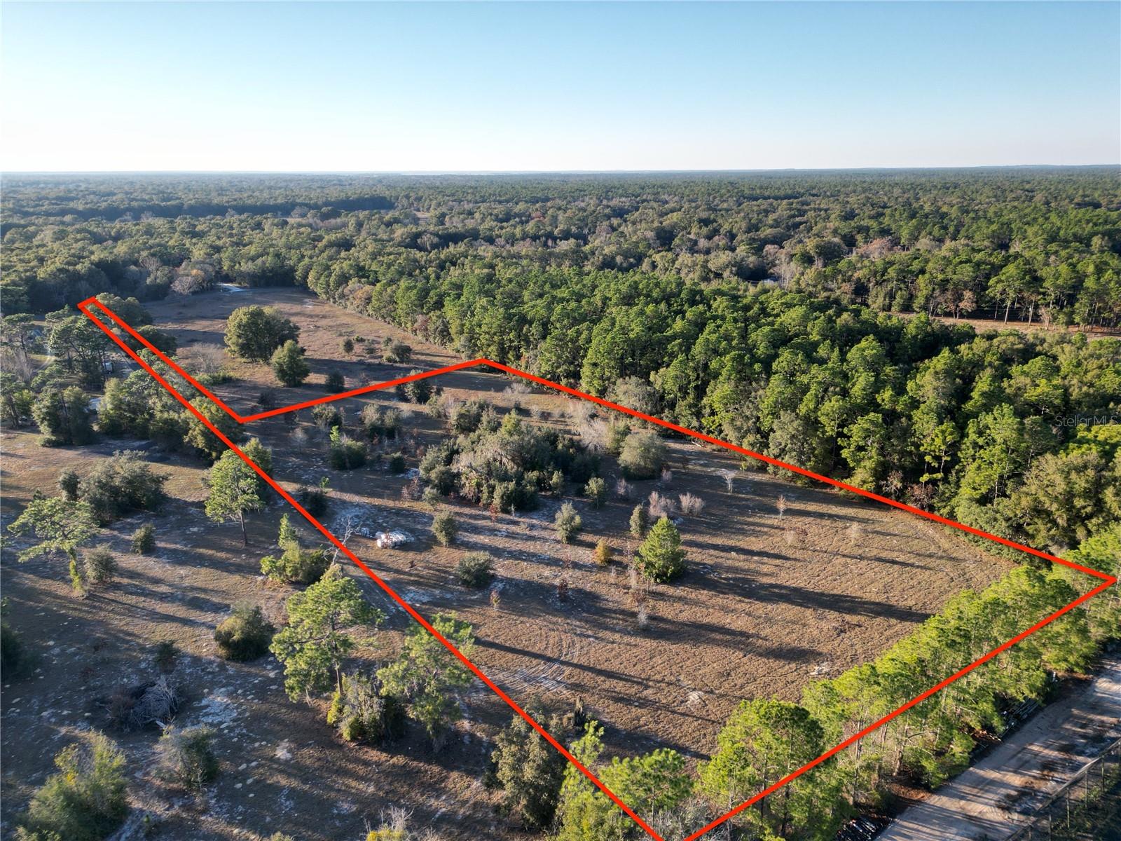 Motivated Seller – Seller Financing Available for Qualified Buyers! 5-Acre Parcel Near WEC ideal for Agricultural Development. This parcel offers a prime opportunity for agricultural development, located just a short drive from the World Equestrian Center (WEC). The property is well-suited for a variety of uses, including a mini farm, hobby ranch, or agricultural venture, and provides ample space for future growth. The land is newly fenced, ensuring security and privacy for livestock or agricultural operations. It also benefits from an easement providing direct access to 110th, offering convenient connectivity to the main road and facilitating easy transportation to and from the property. The location combines the tranquility of rural living with close proximity to essential services, including restaurants, hospitals, gyms, and other amenities. With quick access to Hwy 200, this property is perfectly situated to provide both seclusion and convenience. This is an exceptional opportunity to develop a rural retreat or agricultural property. Don’t miss your chance to invest in this versatile parcel. PARCEL ID - 35319-006-04 is also for sale.
