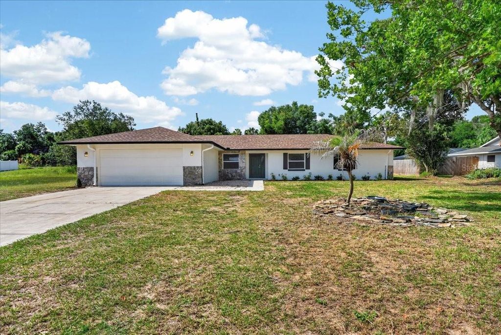 Photo of 5115 Mockingbird Lane, Fruitland Park, FL 34731 (MLS # TB8518699)