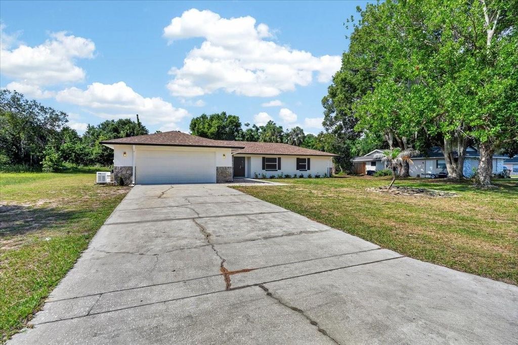 Photo of 5115 Mockingbird Lane, Fruitland Park, FL 34731 (MLS # TB8518699)
