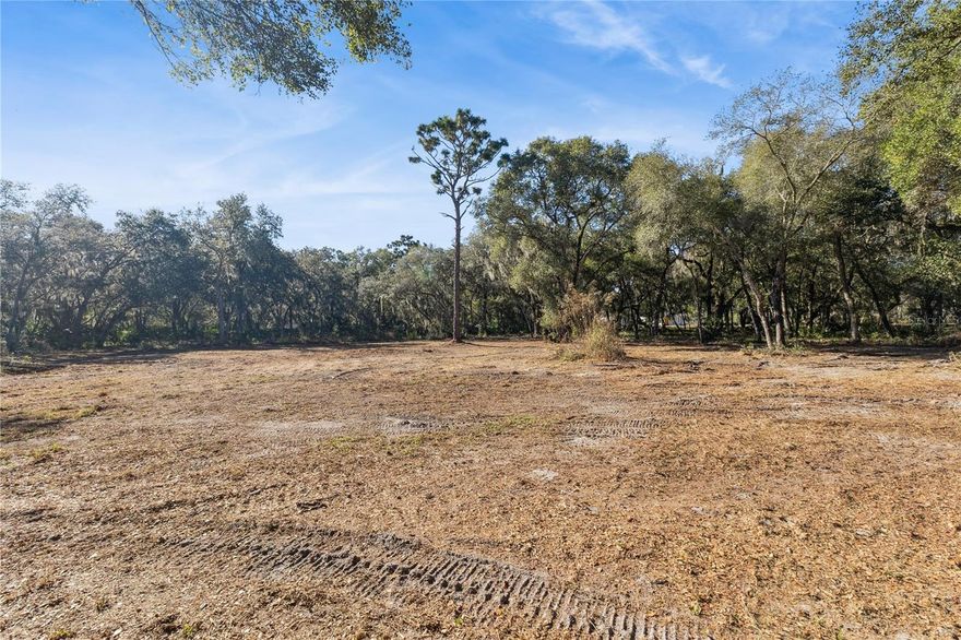 Rare opportunity to own nearly 6 acres of pristine vacant land in the highly desirable Geneva area of Seminole County. This 5.88-acre homesite offers the perfect blend of privacy, natural beauty, and convenience. The property sits on a paved road (Lake Harney Road) and features a long, private driveway approximately 30 feet wide by 458 feet deep, creating a beautiful and secluded entrance from the main road. A secondary access point is available from Old Lake Harney Road at the rear of the property.

A cleared area is already in place, ready for you to build your dream home and barn, while a stunning hammock of mature oak and native trees provides shade, character, and natural privacy. Surrounded by elegant estate-style homes, this peaceful setting feels tucked away yet remains easily accessible with a scenic drive through Geneva.

Located within the Seminole County School District, this property is ideal for those seeking space, tranquility, and room to create a custom estate. Very private, beautifully wooded, and truly one of a kind—don’t miss this rare opportunity to own almost 6 acres in Seminole County.