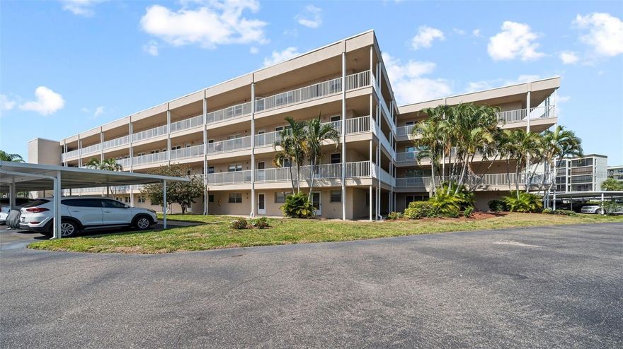 This 2 Bed Rm 2 Bath 4th Floor Unit is Freshly Painted, New Vinyl Flooring. Building has Elevator. Hidden Little Gem and well maintained 55+ Long Bayou Condo Community  Private Carport. Long Bayou has many amenities: Clubhouse & Library, Fitness Center, Auditorium, Heated Pool & Spa. Tennis, Shuffleboard, Pickleball, Bocce ball, Billiards room, Card rooms, Library, and art classes. Not to mention scenic walks along the lakeside path. There's even a workshop where you can use tools, a car washing station, and lots of group activities. Freshly Painted. Mint condition move right in!