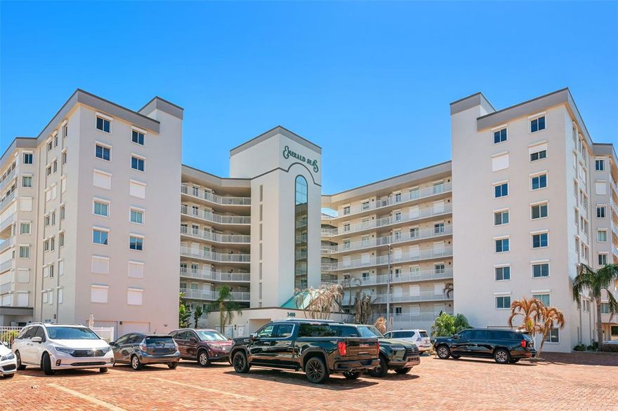This meticulously maintained and fully furnished three-bedroom, two-bath unit at Emerald Seas offers direct ocean views from the living room, primary bedroom, and kitchen. Notable features include recently installed turtle glass sliding doors, storm shutters, and a dedicated laundry room equipped with washer and dryer. The contemporary open kitchen is complemented by custom cabinetry providing enhanced storage. The layout includes a spacious guest bedroom and a third bedroom configured as an office. Community amenities comprise gated oceanfront access, a heated pool and hot tub, fitness center, tennis and pickleball courts, secure underground garage parking, and additional storage. Ideally located in Cocoa Beach, this property is minutes from local attractions such as the Cocoa Beach Pier and Ron Jon Surf Shop, ten minutes from Port Canaveral, and less than one hour from Orlando. This exceptional unit combines comfort with convenient beachside living in a highly desirable Cocoa Beach.  Come See What The Beach Lifestyle Is All About!