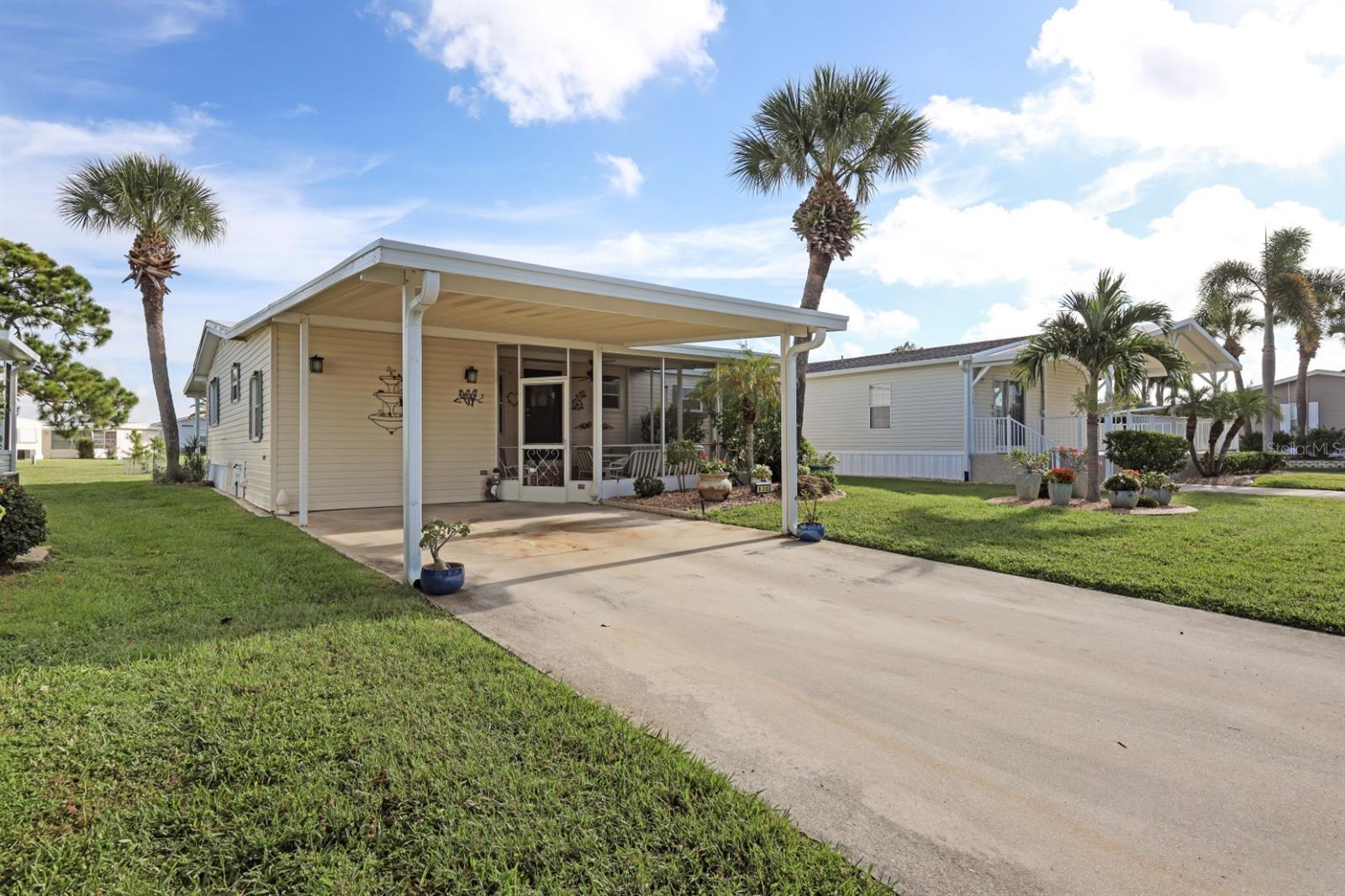 Back on the market through no fault of the seller. Sassy and charming 2 bedroom, 2 full bath home in award-winning Golf Community of Maple Leaf Golf & Country Club! You will feel like you have come home in this well-maintained 1983 double wide manufactured home. It offers 924 square feet of comfortable living space with a desirable split floor plan that provides added privacy for both bedrooms. The kitchen wall was removed to give this the open concept living that is so popular. Add in custom wood cabinetry and granite countertops and you are ready to prepare some delicious meals. Perfect for starting your next chapter whether it is as a seasonal retreat or year-round residence, this home is located in a sought-after award-winning golfing community known for its amenities that never end with a resort lifestyle. The roof was replaced in 2023, roof over rear patio 2023, new vapor barrier 2023, gutters and downspouts 2023, skirting around entire house 2023, air conditioner 2016 and so much more. Step inside to find a bright and airy layout with two spacious bedrooms, each with its own full bathroom, making it ideal for hosting guests. Enjoy the Florida lifestyle year-round with two inviting lanais, one in front with screens and another enclosed lanai in the rear overlooking a huge greenspace and perfect for morning coffee, reading, or simply relaxing in the breeze. This one is being sold mostly furnished with some exclusions and the golf cart is negotiable. Whether you're teeing off in the morning, hitting the pickleball/tennis courts or enjoying a sunset walk, this welcoming community offers the lifestyle you’ve been looking for. Don’t miss this opportunity to own a move-in ready home in a friendly neighborhood where golf, comfort, and convenience meet! In Maple Leaf you'll enjoy over 75+ clubs and activities, 4 heated swimming pools, 2 hot tubs, 5 tennis courts, 4 pickleball courts, 2 shuffleboard courts, 2 restaurants, tiki bar, golf course, woodworker shop, fitness center and so much more. In Maple Leaf they say, "If you're bored, it's your own fault!"