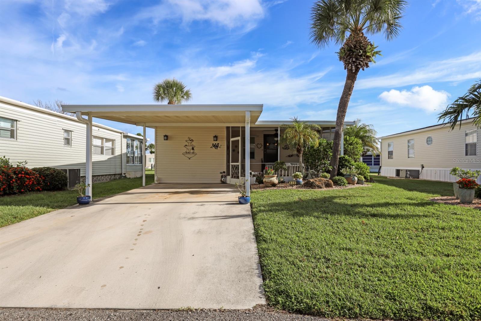Sassy and charming 2 bedroom, 2 full bath home in award-winning Golf Community of Maple Leaf Golf & Country Club! You will feel like you have come home in this well-maintained 1983 double wide manufactured home. It offers 924 square feet of comfortable living space with a desirable split floor plan that provides added privacy for both bedrooms. The kitchen wall was removed to give this the open concept living that is so popular. Add in custom cabinetry and granite countertops and you are ready to prepare some delicious meals. Perfect as a seasonal retreat or year-round residence, this home is located in a sought-after award-winning golfing community known for its amenities that never end with a resort lifestyle. The roof was replaced in 2023, roof over rear patio 2023, new vapor barrier 2023, gutters and downspouts 2023, skirting around entire house 2023, air conditioner 2016 and so much more. Step inside to find a bright and airy layout with two spacious bedrooms, each with its own full bathroom, making it ideal for hosting guests. Enjoy the Florida lifestyle year-round with two inviting lanais, one in front with screens and another enclosed lanai in the rear overlooking a huge greenspace and perfect for morning coffee, reading, or simply relaxing in the breeze. This one is being sold mostly furnished with some exclusions and the golf cart is negotiable. Whether you're teeing off in the morning, hitting the pickleball/tennis courts or enjoying a sunset walk, this welcoming community offers the lifestyle you’ve been looking for. Don’t miss this opportunity to own a move-in ready home in a friendly neighborhood where golf, comfort, and convenience meet! In Maple Leaf you'll enjoy over 75+ clubs and activities, 4 heated swimming pools, 2 hot tubs, 5 tennis courts, 4 pickleball courts, 2 shuffleboard courts, 2 restaurants, tiki bar, golf course, woodworker shop, fitness center and so much more. In Maple Leaf they say, "If you're bored, it's your own fault!"