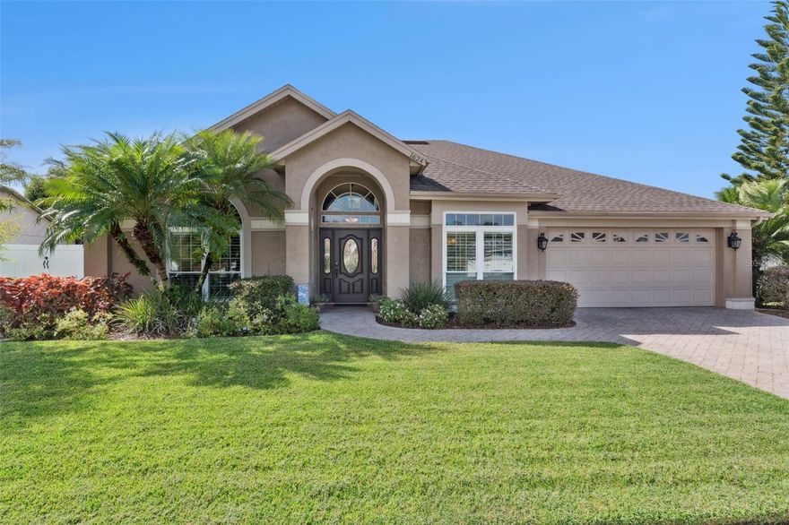 Welcome to 1624 Thornhill Circle in sought-after Oviedo, where timeless design meets modern updates in this beautifully maintained pool home. The home offers wonderful curb appeal with lush, professionally styled landscaping, a handsome brick paver driveway and walkway, and a covered formal entry. Inside, the formal living room with vaulted ceiling and the elegant formal dining room with a tray ceiling set the tone for the spacious open floor plan. The three-way split bedroom layout provides privacy and versatility, while the open kitchen and family room create the perfect gathering space. The updated kitchen features granite counters, tile backsplash, 42-inch wood cabinetry, stainless steel appliances including a glass cooktop and built-in microwave, a closet pantry, and a generous breakfast bar that flows seamlessly into the family room. Soaring ceilings, abundant natural light from four skylights, plantation shutters, and a cozy wood-burning fireplace add warmth and charm, while two sets of newer French doors open to the screened patio and pool.

The primary suite is a true retreat with direct access to the pool, a walk-in closet, and a beautifully updated bathroom offering dual sinks, a soaking tub, walk-in shower, and private water closet. The additional bedrooms include a flexible fourth bedroom with double doors, ideal for an office, den, or study, connected to a full bath. Bathrooms have all been tastefully updated, and upgraded fans and light fixtures are found throughout. Everyday convenience is enhanced by an inside laundry room with utility sink and shelving, plus a 20' x 19' two-car garage with attic access.

Step outside to your private backyard paradise where a screened 32' x 12' tiled patio overlooks the sparkling pool and mature landscaping. White vinyl fencing on the sides ensures privacy, while a lower brick wall across the back reveals serene views of trees and vegetation—no rear neighbors in sight. Major updates bring peace of mind, including a new roof (2018), replumbing (2019), some new windows and French doors (2018). This home is move-in ready and offers the perfect blend of comfort, style, and function in a prime location.