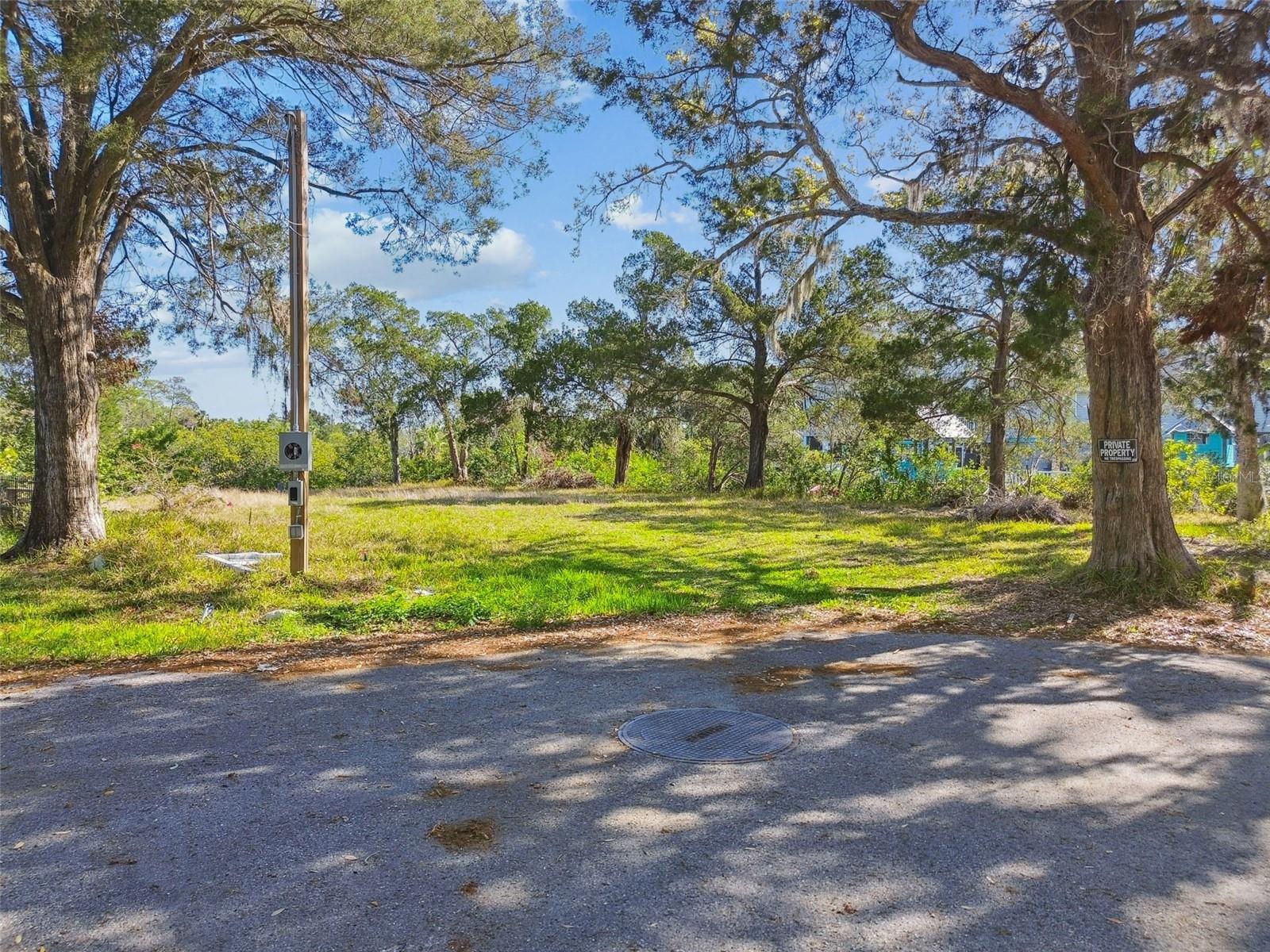 Nestled in the prestigious Martha’s Vineyard subdivision of Port Richey, this exceptional quarter-acre (10,890 sq. ft.) waterfront lot is one of the few remaining parcels in the area, making it a truly rare find. Boasting picturesque waterfront, this property offers breathtaking views along a tranquil canal with direct access to the Bayou and the Gulf beyond that. Imagine stepping out to your backyard oasis, where you can savor stunning sunrises, watch marine life glide by, or set out on the water for a day of boating and fishing.
Outdoor lovers will appreciate being just minutes from Oelsner Park and Port Richey Waterfront Park, perfect for kayaking, picnicking, or simply soaking in the natural beauty. If entertainment is what you crave, the Tropical Breeze Casino provides an exciting escape on the water, while downtown New Port Richey, less than 10 minutes away, offers a lively mix of restaurants, comedy clubs, live music, boutique shopping, and charming cafés. Take a relaxing stroll through Sims Park or enjoy the scenic beauty of Orange Lake.
Whether you’re envisioning a custom-built dream home or a smart investment in waterfront real estate, this prime location delivers the perfect blend of tranquility, recreation, and convenience. Engineering report and survey available. Don’t let this once-in-a-lifetime opportunity slip away—claim your slice of paradise today!