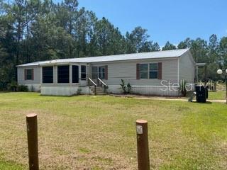 Short Sale. 2002 Doublewide with shed and carport on 1+ acre. Needs some TLC. Short sale approval required Ideal for investor. Roof replaced in 2019. Septic pump replaced recently. Enjoy country living on over 1 acre with no HOA.