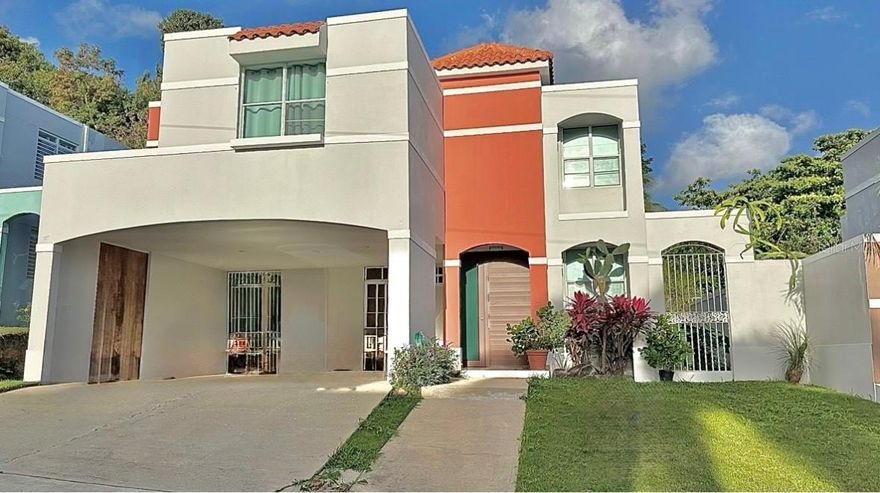 Two-level residence located in the gated community of River Edge Hills in Luquillo. This property features 4 bedrooms, 2.5 bathrooms, and 1,682 sq ft of living area. Includes a laundry room, tools/storage room, and a double carport. The primary bedroom offers a walk-in closet and private balcony. The home has been freshly painted inside and out.
Situated on a spacious and fully usable 669 m² lot, the property offers ample outdoor space with several fruit trees and a lot size significantly larger than most homes in the community.
River Edge Hills offers controlled access, a community pool, and a children’s playground. Conveniently located just minutes from Balneario La Monserrate, the Luquillo Kiosks, La Pared, El Yunque, restaurants, supermarkets, pharmacies, and bilingual schools.
HOA: $50 monthly.
For more information, call today.