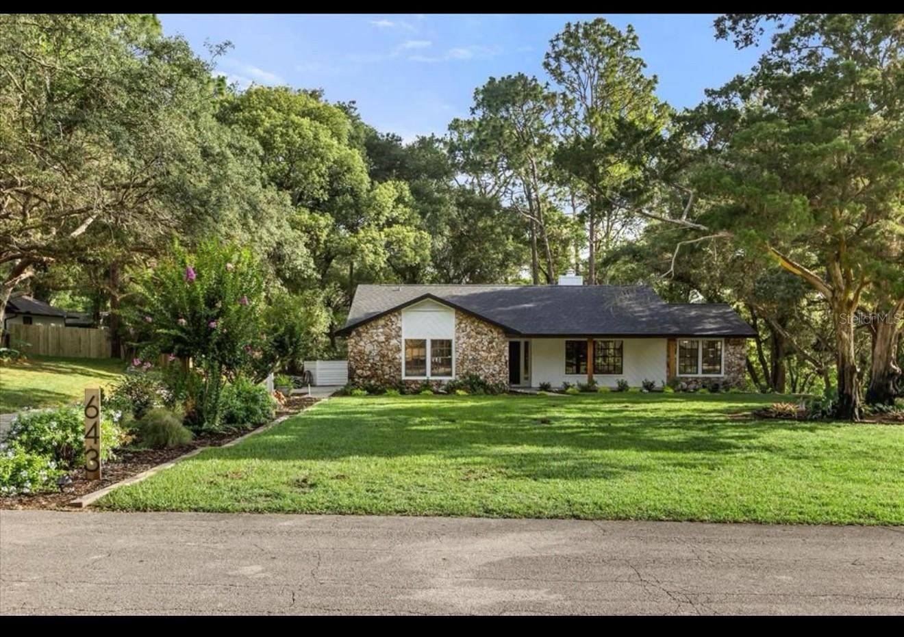 Nestled in the peaceful Long Leaf Plantation neighborhood of DeLand, Florida, 643 Princewood Dr offers a serene and spacious living experience. This charming 3-bedroom, 2-bathroom ranch-style home is situated on a generous lot, with the property's natural beauty enhanced by towering oak trees and an expansive backyard, providing the perfect backdrop for outdoor activities or simply unwinding in the tranquility of nature. Upon entering, you are greeted by a welcoming living room with beautiful, BRAND NEW vinyl flooring and a cozy wood-burning fireplace, setting the tone for a comfortable and inviting space. The open-concept layout flows seamlessly into the dining area and right after that, an upgraded kitchen, offering an ideal space for entertaining family and friends. The kitchen is equipped with all the essentials, including a range/oven, refrigerator & dishwasher. It offers ample cabinet space for storage and plenty of room to prepare meals with ease. The master suite is generously sized, featuring a large closet and easy access to the backyard, making it a perfect retreat. The master bath offers a comfortable space for relaxation with a well-appointed layout. Two additional bedrooms provide versatility, whether used as guest rooms, a home office, or hobby spaces. The second bathroom, located near the other bedrooms, is clean and functional. Step outside and enjoy the Florida weather on the screened porch, ideal for dining al fresco or enjoying a cup of coffee in the morning. The porch leads to a large wood deck, perfect for grilling, entertaining, or just soaking in the beauty of the expansive, tree-lined backyard. With plenty of space, there's room for family to play, pets to roam, or for future landscaping projects. Additional features of this home include central heating and cooling, an attached 2-car garage. UPGRADES GALORE!! Band new roof, brand new A/C, brand new vinyl flooring throughout, newer appliances, brand new paint, brand new fixtures, upgraded bathrooms, brand new decking and railings in the patio, making it move-in ready for its next owners. Located just minutes from historic downtown DeLand, this home provides easy access to local shops, cafes, parks, and Stetson University. Whether you're enjoying the vibrant downtown area or exploring the surrounding nature, this location offers the best of both worlds peaceful suburban living with proximity to everything you need. see realtor remarks