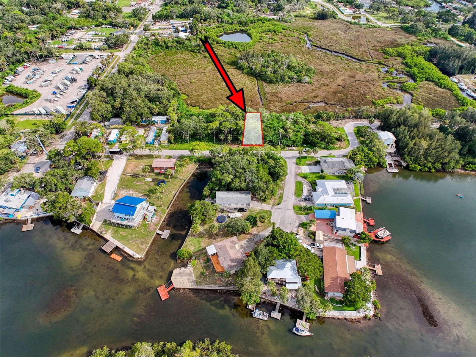 This undeveloped lot is located in the WATERFRONT COMMUNITY of DRIFTWOOD ISLES. Although its not directly on the water is does have some WATERVIEW. All your local restaurants like INN ON THE GULF, SAM'S BEACH BAR, OLLIE"S ON THE BEACH and GET HOOK are a 5-minute drive. HOSPITALS & SHOPPING are also nearby. The TAMPA BAY AIRPORT, TAMPA BAY, CLEARWATER BEACH, HOMMOSSA SPRINGS, TARPON SPRINGS, PINE ISLAND, HONEYMOON ISLAND and WEEKI WACHEE are approximately 1 hour away. The Seller will pay $1,000.00 concessions for full price to the buyer for closing costs and/or repairs