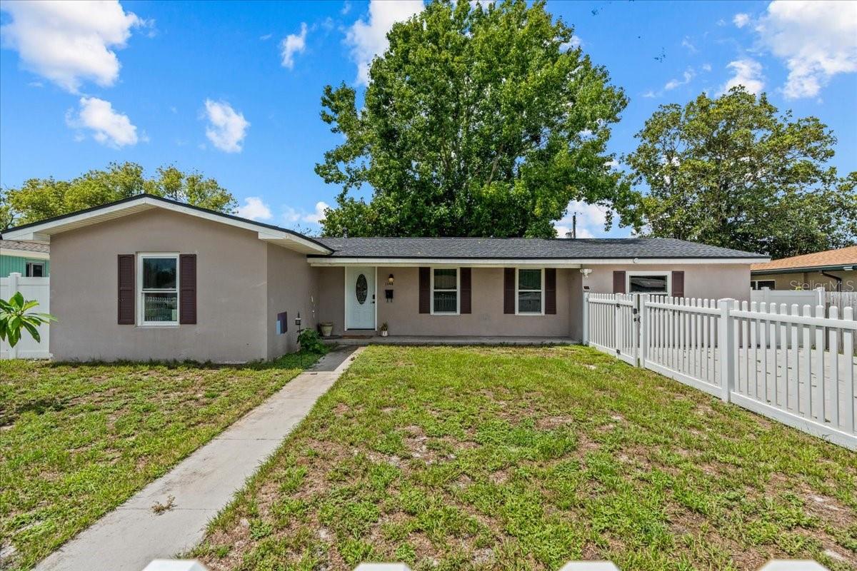 This 4 bed/2.5 bath home is where thoughtful updates and practical features come together. Step inside to find ceramic tile flooring throughout, offering a clean and cohesive look. The kitchen is equipped with wood cabinets and granite countertops, providing both style and durability for everyday use. Peace of mind comes with recent improvements, including hurricane-rated PG-50 Wind Load windows installed in 2021 and a new roof added in 2022. Outside, the fully fenced yard offers privacy and space for pets, gardening, or simply relaxing outdoors. The location adds to the convenience, with shopping, Boston Coffee House, and local restaurants just minutes away. This home combines comfort, updates, and accessibility, making it a solid choice for your next move.