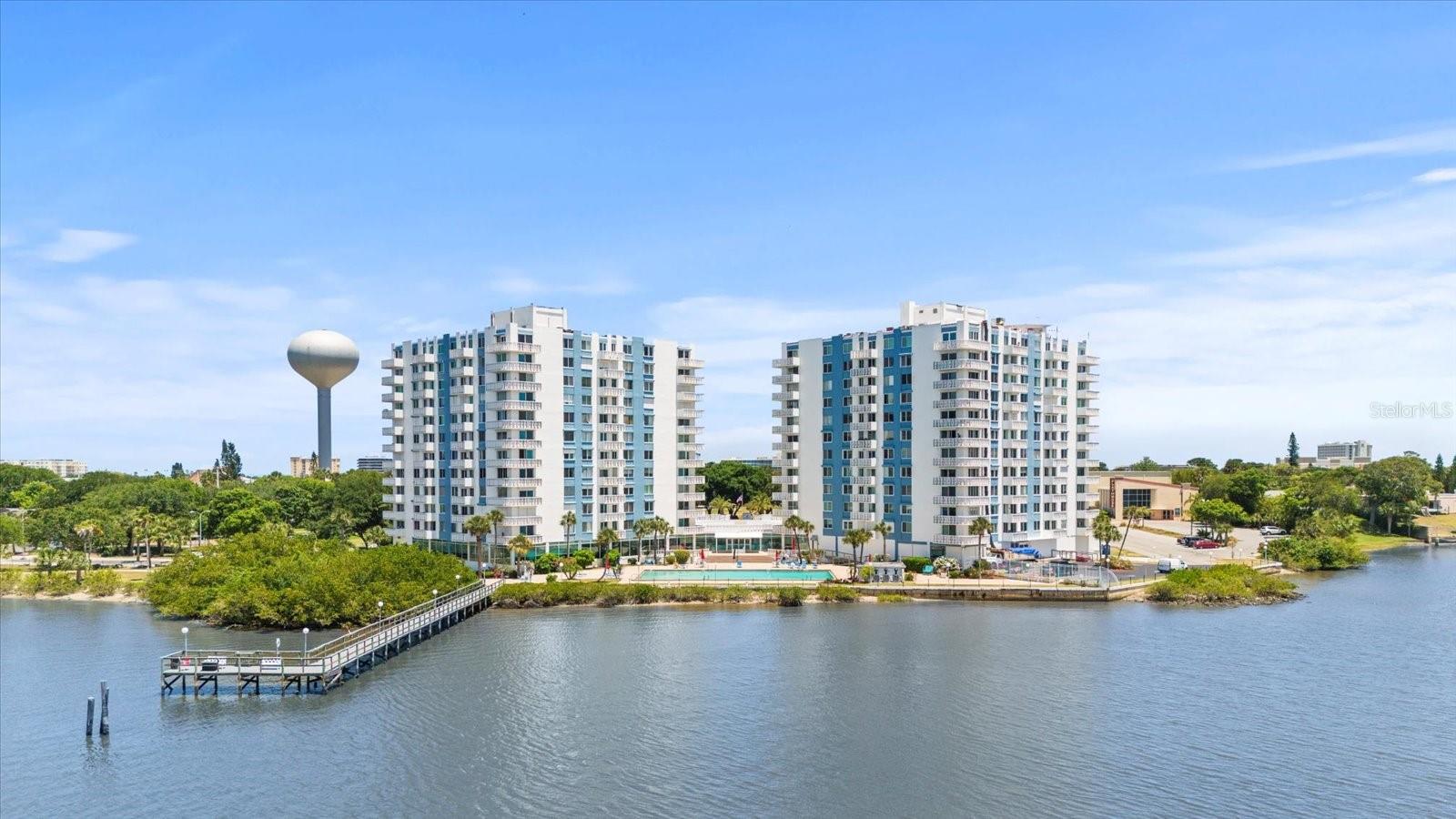 Welcome to your dream riverfront retreat! This stunning first floor 1-bedroom, 1.5-bathroom condo offers a perfect blend of comfort and elegance, with breathtaking views of the river that will leave you mesmerized. You have the benefits of the first floor entrance and the vibes of a multi story views! Step inside to discover an open-concept living space, featuring large windows that flood the room with natural light and showcase the picturesque river views. The modern kitchen is equipped with sleek appliances and ample counter space, making it ideal for both cooking and entertaining. The spacious bedroom is a serene sanctuary, complete with an en-suite bathroom for added convenience and a huge walk-in closet. A convenient half-bath is perfect for guests, ensuring privacy and comfort. Enjoy your morning coffee or unwind in the evening on your private balcony, where the soothing sounds of the river create a peaceful ambiance. The condo also includes access to community amenities such as assigned underground parking, tennis courts, a card room, a billiard room, a direct riverfront pool with amazing views, an outdoor grill, dock to fish off of, a pool, fitness center, and walking trails along the river. Your association dues also include cable, internet, maintenance grounds, sewer, trash, water and building insurance! Located in a vibrant neighborhood, you're just minutes away from the World's Most Famous Beach, local shops, dining, and entertainment. Don't miss the opportunity to own this exceptional riverfront condo, where every day feels like a vacation! All information taken from the tax record, and while deemed reliable, cannot be guaranteed.