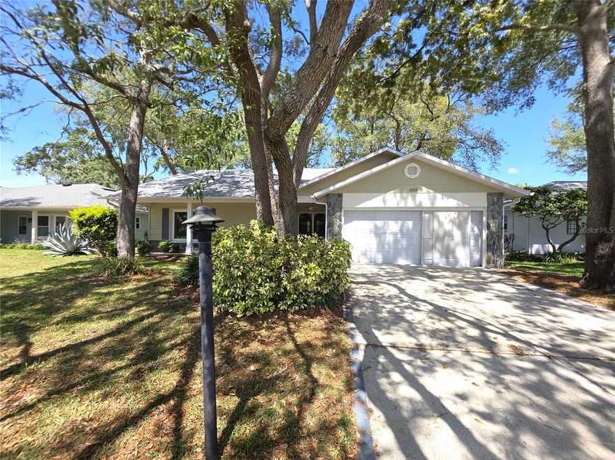 Enter The Home from The Front Porch And Dual Door Entry To Living And Dining Rooms- Tiled Eat In Kitchen With Dual Sinks And A Dining Area- The Primary Bedroom Has A Walk In Closet, Dual Sinks And A Tiled Walk In Shower- Glass Enclosed Lanai With Central Heat And Air For Added Living Area- Extras Include Screened Garage, All Crown Molding, Ceiling Fans, Roof replaced 2025, Newer Windows, Remodeled Bathroom, Gutters, Irrigation Well System, Brick Paver Open Patio, Open Floor Plan- Call Today For A Showing. Timber Pines, a 55+ Gated Community, With 4 Golf Courses, Country Club, Remodeled Restaurant And Bar With Multiple TV Screens, 2 Pools, Fitness Center, Tennis And Pickle Ball Courts, Bocce Ball, Billiards Room And More Than 100 Different Clubs. Spectrum Cable, 2 boxes and High-Speed Internet Are Also Included In the HOA.