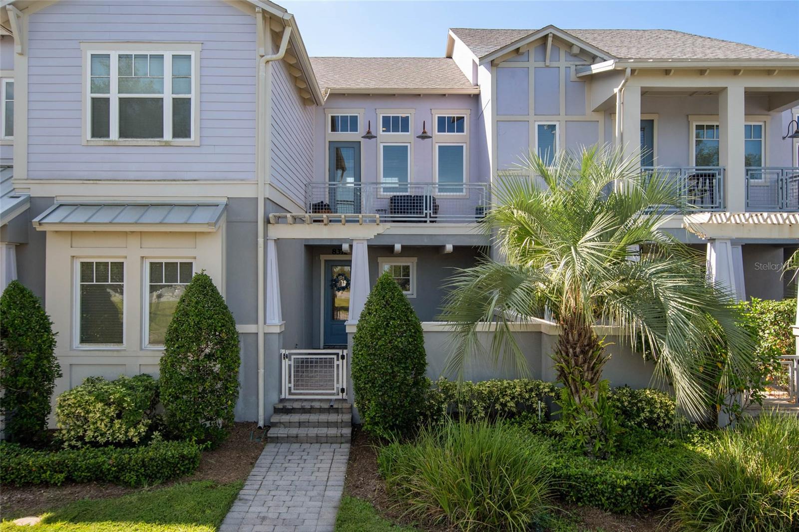 Live the Laureate Park lifestyle in this immaculate, move-in ready, and beautifully maintained 2-bedroom, 2-bathroom townhome, ideally located in the heart of one of Lake Nona’s most vibrant communities. Just steps from your front door, you'll find the renowned Canvas Restaurant & Market, the Laureate Park Resort-Style Pool, state-of-the-art Fitness Center, and Crescent Park, where community events like outdoor movie nights bring neighbors together. Whether you're grabbing your morning coffee, enjoying dinner out, or hosting guests, the best of Laureate Park is just a short walk away. This charming home welcomes you with a spacious front courtyard, perfect for relaxing and enjoying Florida’s beautiful weather year-round. Inside, the entry level features a versatile bonus space that can serve as a mudroom, home office, guest area, or flex space tailored to your needs. As you head upstairs, you’ll be greeted by soaring ceilings, engineered hardwood flooring, elegant wrought iron spindles, and exposed wood beams, all combining to create a warm and inviting ambiance. The open-concept living area is filled with natural light from large windows and offers access to a private second-story balcony — an ideal spot for morning coffee or taking in stunning Lake Nona sunsets. The chef’s kitchen is both stylish and functional, featuring granite countertops, shaker-style cabinets with crown molding, a glass tile backsplash, upgraded deco paneling on the island, pot and pan drawers, pendant lighting, and stainless steel appliances, including a newer dishwasher. The kitchen flows seamlessly into the spacious dining area and comfortable family room, creating the perfect setting for everyday living or entertaining. Down the hall, you’ll find a guest bedroom with upgraded carpet, a full bathroom, and a laundry closet with a stackable washer and dryer. At the back of the home, the private primary suite offers a peaceful retreat with upgraded carpet and padding, a stylish shiplap accent wall, and plenty of natural light. The ensuite bathroom includes dual sinks with granite countertops, a soaking tub, a walk-in shower with frameless glass enclosure, a private water closet, and an oversized walk-in closet to meet all your storage needs. Additional features include an oversized two-car garage with a full driveway, ceiling-mounted storage racks, and guest parking available both in front and behind the home. A fresh exterior paint update is also coming soon. This low-maintenance home is your key to enjoying the best of the Lake Nona lifestyle. Laureate Park community, residents enjoy HOA Includes HIGH-SPEED INTERNET of up to 1GIG, LP Fitness Center, Resort-Style LP Aquatic Center with Beach Volleyball Court & a half Basketball Court. Laureate Park also offers Community Gardens, Dog Parks, Playgrounds, and Miles of Trails to enjoy Walking, Running, and Biking. Located in the heart of Lake Nona Medical City. A RATED SCHOOLS & Minutes to Orlando International Airport, Major Highways, Shopping, Dining, USTA & KPMG. This home is truly a masterpiece—schedule your private tour today and experience luxury living at its finest!