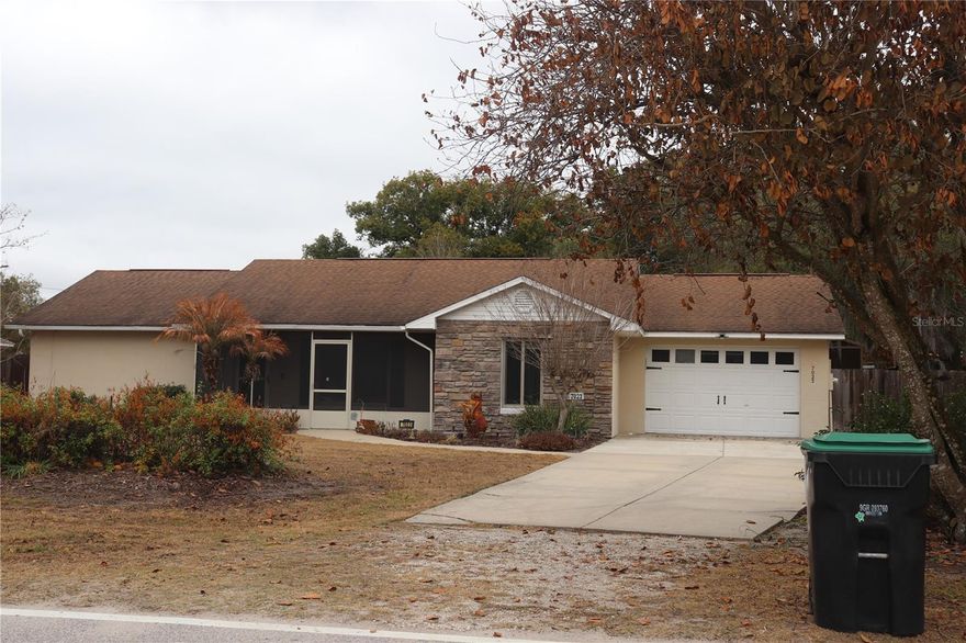 Welcome to 7023 Wright Avenue in Mount Dora! This 3-bedroom, 2-bath home offers 1,847 square feet of open-concept living space, built in 1993 and featuring a cozy fireplace as the centerpiece of the main living area. Situated on a spacious .33-acre lot, you'll love the oversized backyard with plenty of room to entertain, garden, or even add a pool -all with no HOA restrictions. Other updates include Roof 2009/2017, Re-pipe 2017, AC 2018, Water Heater 2019, new exterior paint 2021 and interior paint, hurricane proof garage door. You will love living in the quaint town of Tangerine filled with historic charm and character. Conveniently located near shopping, dining, and historic downtown Mount Dora, this home offers space, comfort, and flexibility in a prime location. Schedule your showing today!