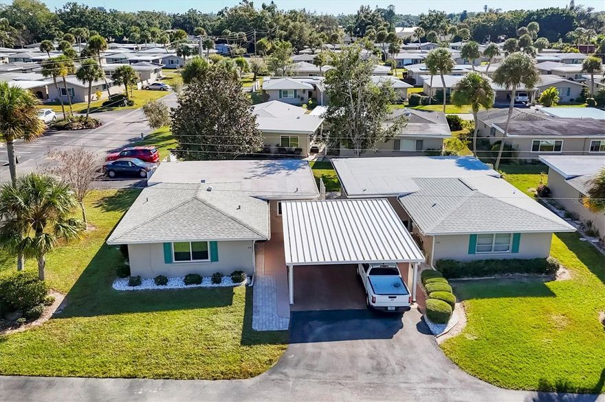 RUN home to 26 Strathmore Boulevard — a spotless, move-in ready 55+ villa just steps from the community pool and activity center. This sunny 2-bed / 2-bath, 1,195 sq ft home has been lovingly upgraded (over $50,000 invested) and is offered in exceptional condition and competitively priced. Highlights include granite countertops, tray ceilings, oversized ceramic tile throughout, updated full baths, PGT windows, a separate storage shed and a private paver patio with walkway. Practical upgrades: AC replaced 2023; new carport roof 2024; roof 2016; underground cast-iron pipe restoration 2022 ($14,000); flooring 2021 (oversized tile); interior & exterior painting plus professional steam cleaning in 2025; kitchen white appliance package updated 2023–2024 and disposal 2025; all-in-one washer/dryer 2023. Enjoy being across the street from the pool, shuffleboard courts and a lively community center that hosts holiday events, luncheons, dinners, game days and more. Clean, upgraded, and convenient — don’t wait on this one.