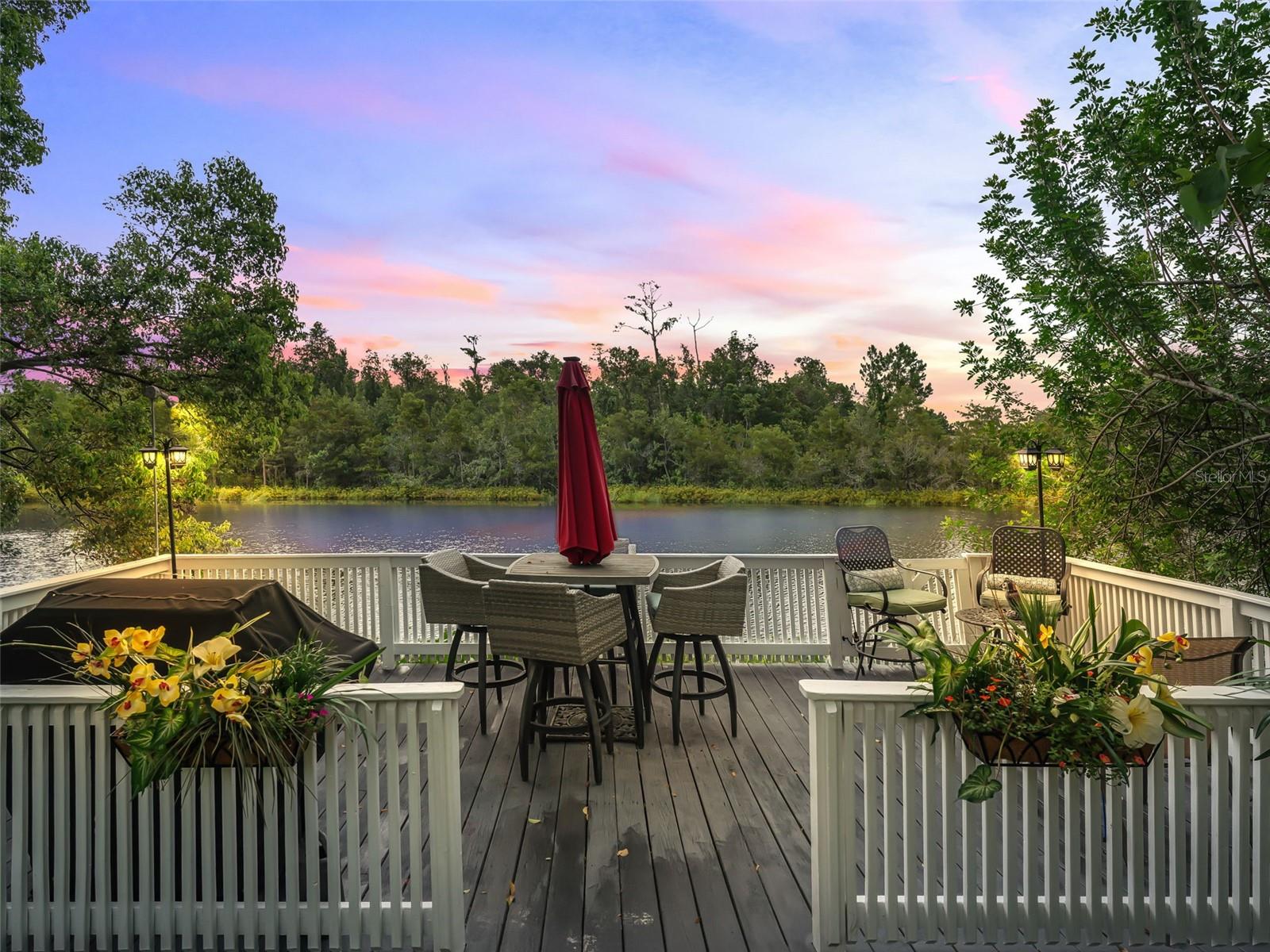 LOCATION, LOCATION, LOCATION this custom Built Waterfront 4BR/2 ½ Bath Charmer is the Only home in Southchase/Hunters Creek backing up to a Conservation Private Lake. The only home with a dock on this lake. The home features a uniquely built 12 x 24 Dock where quiet evenings can be spent enjoying the peace of this pristine lake. No other homes on this lake have dock access. Makes for the perfect family retreat. Lush landscaping surrounds the home. The back area of This home is where you will share hours of enjoyment. The home is situated minutes away from the Florida Turnpike and the 417 Expressway. 15 minutes from MCO International Airport. Minutes from all attractions. This location provides Travel Convenience at its absolute BEST.
The Open Floor plan with Gorgeous Fireplace provides plenty of room for a formal dining room or great room concept. The Eat in kitchen spills into a huge
324 sq ft Windowed Porch/Lanai off the kitchen was added several years ago. This large room could be a Bonus Room, Master Bedroom or easily divided into two rooms. Maybe even a Hot Tub. This room has a Mini Split AC/Heat Unit. All the bedrooms are upstairs and are good sized. The bedrooms have nice sized closets and beautiful natural lighting. The En Suite is large and has a huge Walk-In Closet. Dual Sinks in the En-Suite Bath with Garden Tub will provide quiet away from a hectic day. 2 Car Garage and driveway for multiple cars when entertaining. A one year American Home Shield Warranty is included.