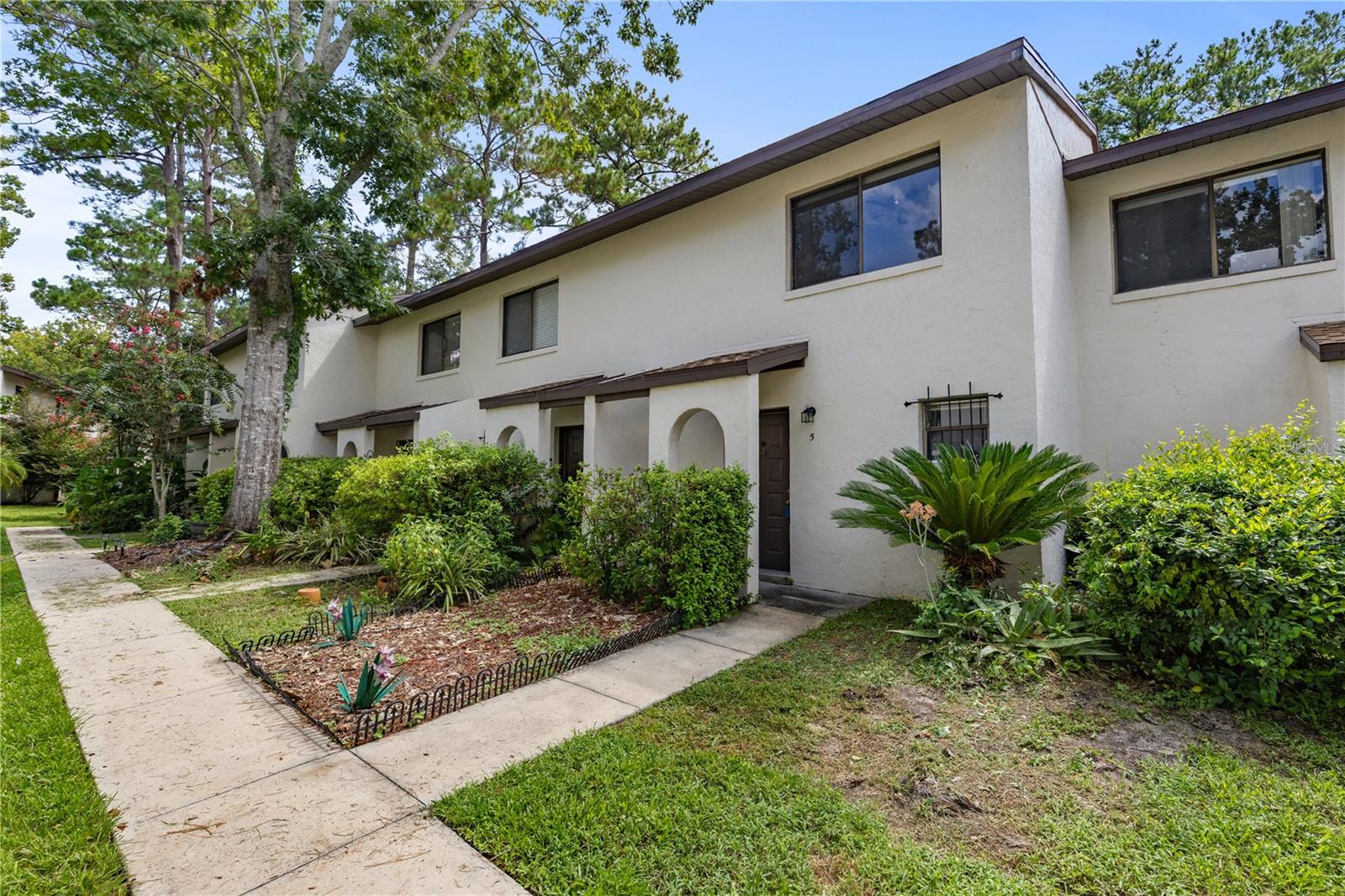 Casablanca East move-in condition townhome with 2 bedrooms, 2 full baths and one half-bath. This unit has beautiful vinyl plank and laminate flooring, quartz countertop in kitchen, updated and upgraded bathrooms and recent paint. It is ready for immediate closing and occupancy and comes fully equipped with all appliances: refrigerator, dishwasher, oven/range, clothes washer and clothes dryer. Casablanca East has picturesque, well-kept grounds with amenities including a pool and clubhouse. HOA dues also provide: water / sewer, high-speed internet, building structure hazard insurance, exterior maintenance, roof and pest control. This super convenient location offers quick, hassle-free access to the University of Florida, Shands Hospital, VA Medical Center, UF College of Veterinary Medicine, I-75, downtown and Southwest Gainesville’s shopping, dining and entertainment venues! It’s ideal for first-time buyers, students, investors, retirees, parents purchasing for kids and sports fans looking for their own Gator-Getaway. The bus stop for the Gator Circulator route is right out front and makes getting to campus quick and easy with no parking aggravations. It’s also an easy bike ride!