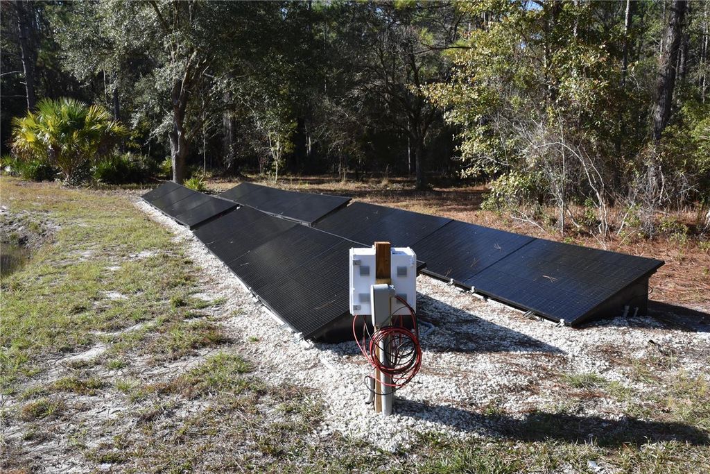 Photo of 150 Caravelle Farms Road, Palatka, FL 32177 (MLS # OM716388)