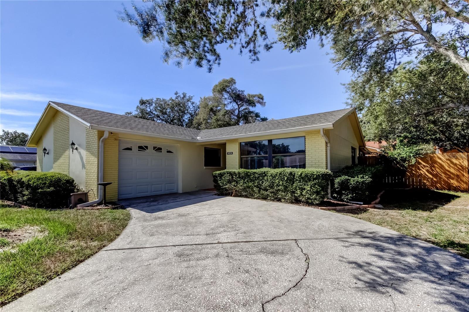 Welcome to this CHARMING, Move-In-Ready, 3-Bedroom, 2-Bath, 1 car-garage, block construction home ideally located in the heart of beautiful Tarpon Springs. Recent updates include a NEW ROOF (July 2025) and all New Stainless Steel kitchen appliances (2025) - Dishwasher, Microwave, Stove & Refrigerator. Other 2025 updates include the Garage Service Door, Water Heater & LG Dryer. Inside, you will find easy-care Vinyl flooring throughout - NO CARPET! The home has been FRESHLY PAINTED inside and out. The long, curved driveway provides extra space for guest parking. Security and peace of mind come with a TRANSFERABLE ADT system. Great news here: This home has NEVER flooded and located within a Non-HOA community - so no monthly fees! Step outside to the SPACIOUS 24' X 12' screened lanai overlooking the landscaped, fully fenced-in back yard - perfect for relaxing mornings or entertaining guests. The lanai can also be enclosed or partially enclosed to create another room for additional living space, if desired. The large yard provides privacy and a tranquil outdoor living space for family, friends & pets. Conveniently located just minutes from the beautiful Gulf Beaches where you can fish, boat, swim or just relax. Take a walk Downtown where you can enjoy a welcoming atmosphere of shops, restaurants, a winery & more. Maybe enjoy a bike ride on the Pinellas Trail or partake in a Sponge Boat Tour at the World-Renowned & Historic Sponge Docks. Florida living at it's finest! Don't miss this opportunity to own a move-in ready home before the rush of the upcoming holiday season!