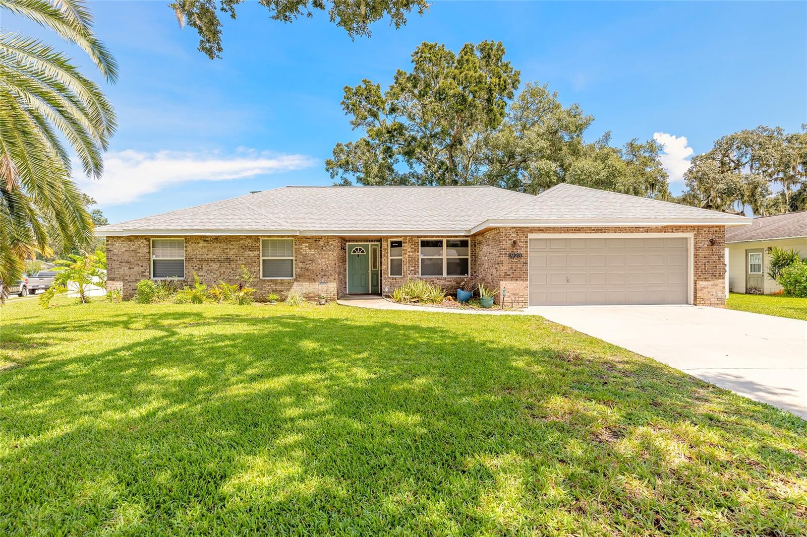 4-bedroom, 2-bath single-family brick home. Centrally located in beautiful Port Orange Florida. Situated on a spacious corner fenced lot. This home features modern amenities including solar panels (owned not leased) which significantly reduce energy bills. Newer roof replaced in 2021, including new hardware for the 20 solar panels. Hybrid water heater (2022), combined gas and/or electric stove, along with 2 solar attic fans for optimal efficiency. Newer washer and dryer. The thoughtfully designed split floor plan is ideal for families or multigenerational living. The extended cement driveway accommodates large vehicles with ease. Large, fenced corner lot. Glassed lanai for all weather enjoyment, as well as a separate slab for BBQ or sunbathing. Newer shed, washer and dryer. With its excellent location and family-friendly features, this home is an exceptional opportunity for first-time buyers or investors. Preferred Port Orange school district. Minutes to the river, beach, shopping, highways and colleges/universities.