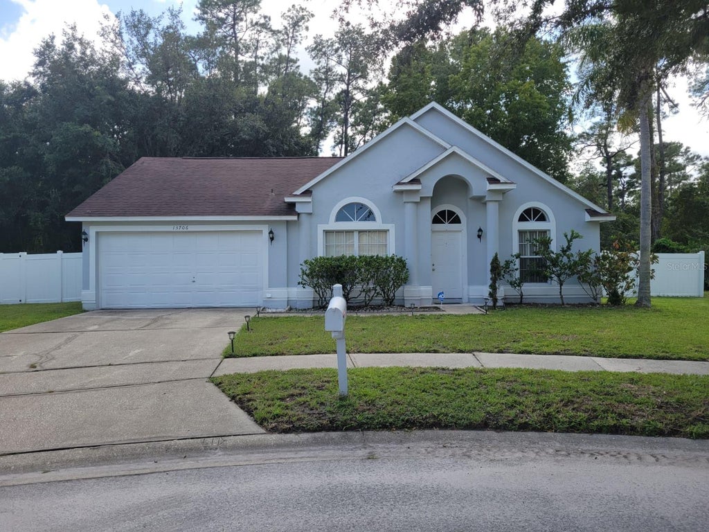 Photo of 13706 Riverpath Grove Drive, Orlando, FL 32826 (MLS # O6443523)