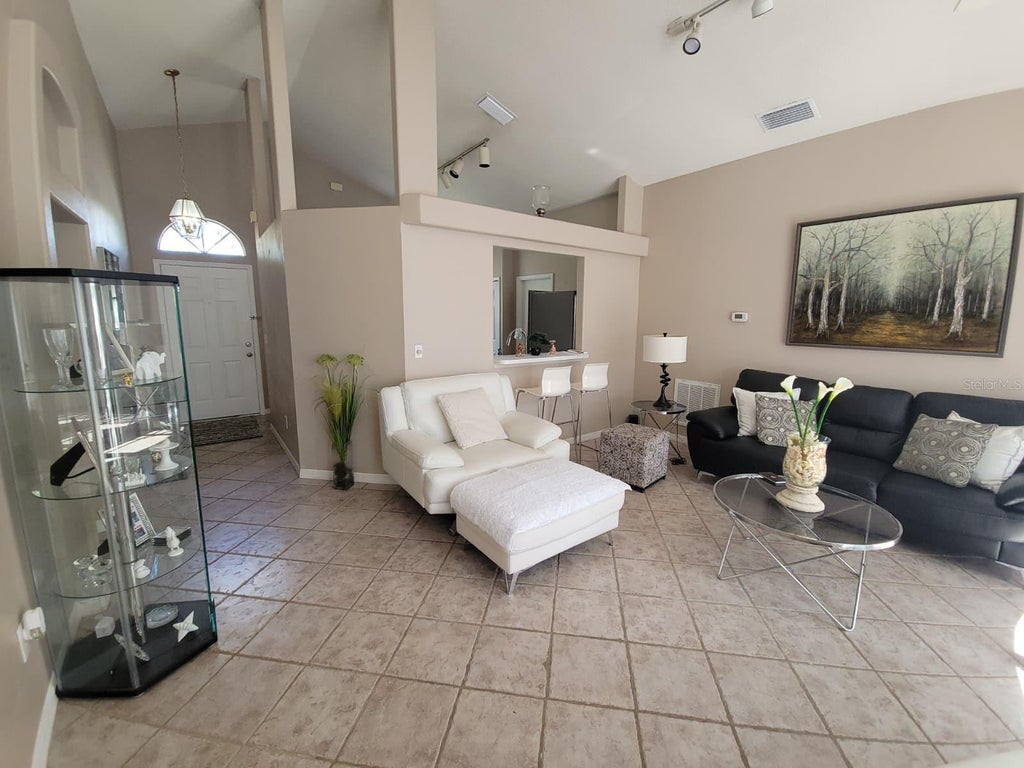 Photo of 13706 Riverpath Grove Drive, Orlando, FL 32826 (MLS # O6443523)