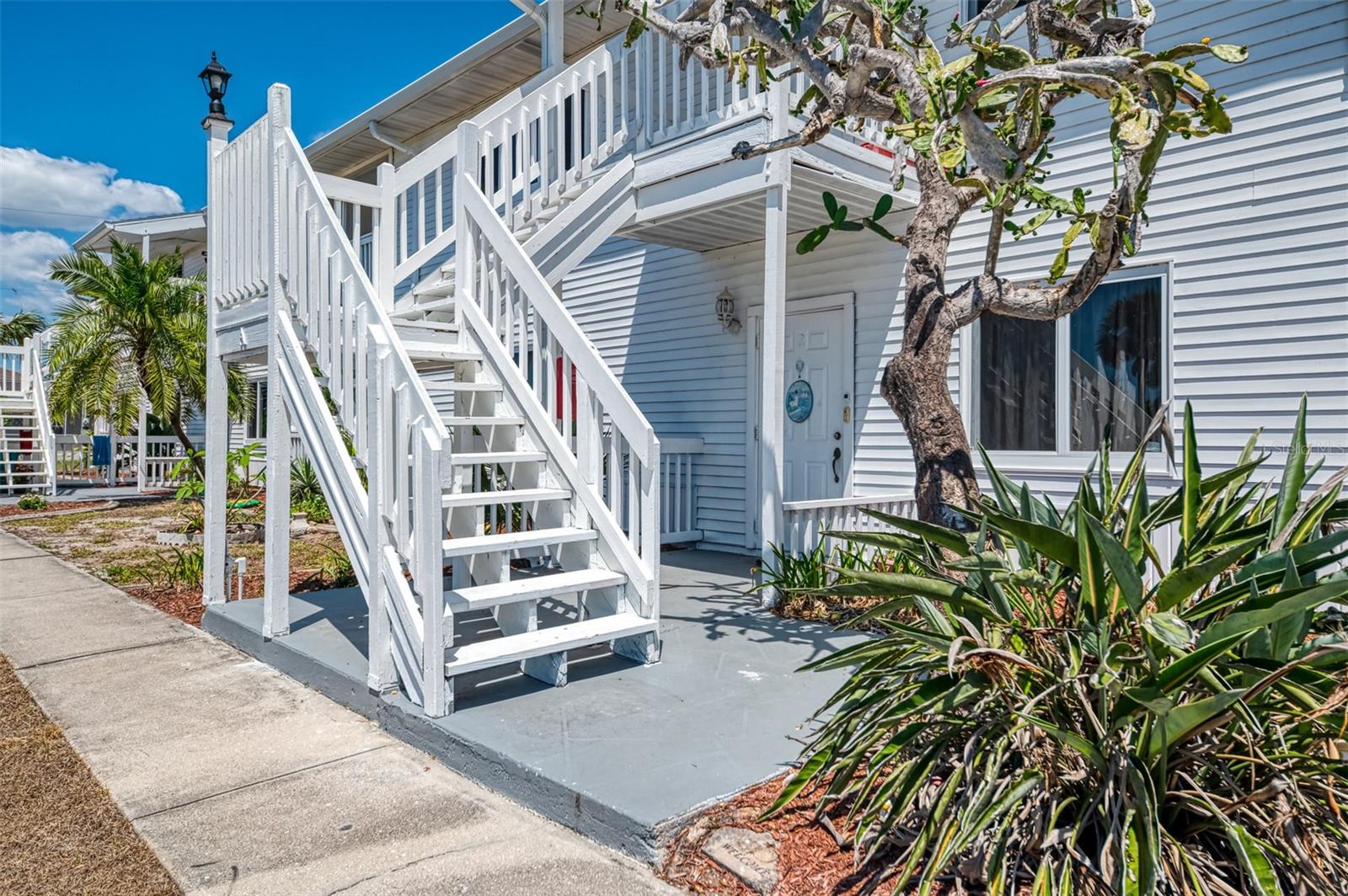 Welcome to the charming community in Rotonda West. Boasting a prime location on the first floor, 2 bedrooms and 2 baths condo with open floor plan. Open floor plan offers a kitchen with breakfast bar, separate dining area and opens to the living room with sliding glass doors to the lanai. The kitchen boasts ample cabinets and counter space, while the dining/living room combo provides an inviting space for relaxation and entertainment, offering a seamless flow for everyday living. Tucked away in a hall closet, the inside laundry area features stackable washer and dryer for added convenience. Both bedrooms provide their own unique appeal, with the guest bedroom providing ample space for guests with a built in closet and ceiling fan. The master bedroom boasts a spacious layout, complete with a walk-in closet for storage ease. The master bathroom features a single sink and walk-in shower, while the guest bathroom features a sink and shower/tub combo. Step out onto the lanai to savor the nice quiet space, where you can start your day with a tranquil cup of morning coffee watching the sunrise or unwind in the evenings. You will enjoy going to the community pool to relax after a long day. Rotonda West is a deed restricted golf course community. Located near area beaches, bike trails, fine dining, shopping, Boca Grande, 5 premier golf course and world class fishing.