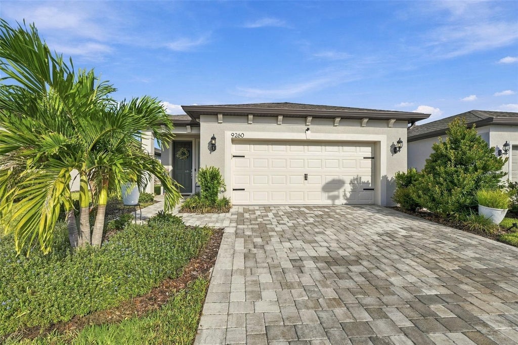 Photo of 9260 Ballaster Pointe Loop, Parrish, FL 34219 (MLS # O6446445)