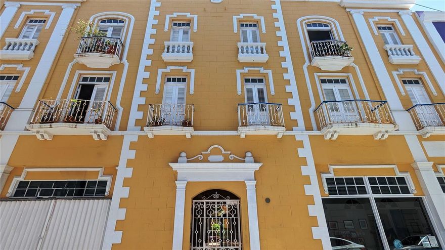 Elevated Old San Juan Living: Stunning 3-Bedroom Furnished Haven in an Iconic Condominium
Imagine stepping into the ultimate Old San Juan lifestyle. This isn't just an apartment; it's a beautifully curated experience in one of the district's most coveted and iconic historic buildings. This turnkey, fully furnished 3-bedroom residence seamlessly marries authentic historic charm with modern, essential convenience. Your home features an extraordinary, serene interior courtyard, a rare and prized amenity in Old San Juan, centered around a majestic, mature ficus tree. This tranquil oasis offers a spectacular, peaceful escape—the perfect place to enjoy your morning coffee away from the bustle of the city. Key Features for Modern Comfort and Productivity. This bright and airy 3rd-floor walk-up gem is designed for refined living:
Premium Natural Light & Cross-Ventilation: Enjoy a consistently refreshing atmosphere with superb natural light streaming in and excellent cross-breeze throughout the day—a highly sought-after feature in historic properties.
Ultimate Convenience: Say goodbye to laundromats with an in-unit washer and dryer. The fully equipped kitchen is ready for everything from quick breakfasts to gourmet entertaining.
Flexible Living Space: Two of the rooms are optimally configured as a dedicated home office and a private exercise/flex room, providing the necessary space and separation for maximum productivity and wellness right at home.
The Master Sanctuary: The oversized master bedroom is a sun-filled retreat, offering ample space for relaxation and comfort.
Year-Round Climate Control: Stay cool and comfortable with air conditioning installed in the primary bedroom and the flexible-use room.
Experience Old San Juan from Your Private Balcony:
Step out onto your private balcony that opens directly onto picturesque Cruz Street. You won't just be near the action; you'll be immersed in the vibrant life, historic architecture, and energy of the district. Every day, the charm of Old San Juan is right outside your door.
This unique apartment is the ideal fusion of historic authenticity and modern-day luxury. It's perfect for a discerning professional or a couple seeking a one-of-a-kind home base that captures the heart and soul of the city. Don't just live in Old San Juan—experience it.