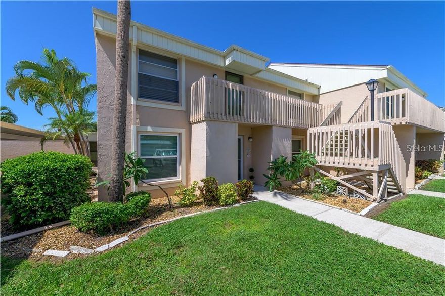 Renovated desirable ground floor end unit 3 bedroom, 2 full bath condo just 7 minutes to the beach. Pebble Springs has 7 pools! Your heated pool is right out your back patio doors. New paint, new vinyl plank floors. The hurricane IMPACT WINDOWS are excellent for energy efficiency and sound. Tucked in a flood zone X, 28 feet up, no chance of flooding. New refrigerator, new washer and dryer, assigned covered parking spot is steps away from front door. Updated ceilings are smooth. The kitchen is open and bright and has lots of cupboards and newer stainless steel appliances. Indoor laundry includes new washer and dryer. The primary bedroom has a walk-in closet and the bath has dual sinks and a shower. The hall bathroom has a tub/shower combination. Sliding glass doors open to the screened lanai which is just steps from the pool. There is an outside storage closet. Small pet allowed. The lanai overlooks the pool and well maintained grounds. The community is walking distance to shopping, local restaurants and close to the area beaches. Great safe community with events and activities.