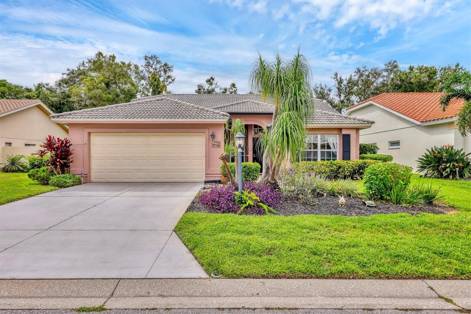 Charming 2BD/2BA with sunlit OFFICE, plus the ultimate private pool in a prime location just south of University Parkway in Sarasota County. Lovingly maintained home offers a flowing split floor plan with a Guest Bedroom and Bath at the front of the house and a Master Suite at the rear of the home. Broad Master Bedroom sliders open to the screened pool area. The spacious Master Suite with a transom window and a ceiling fan provides natural light and cool air flow. The adjacent Master bathroom, separated by a pocket door, opens to a dressing sink, plus a large walk-in closet, a convenient linen closet, a soaking tub, a stand-alone shower, and a commode with a closed door.  The living, dining, kitchen, baths, and office are neutrally tiled for designer touches. The full-sized kitchen with breakfast nook offers a full view of the screened enclosed pool and beautifully landscaped backyard. Privacy abounds. The chef will be delighted with the broad counterspace for delicious meal prep and easy serving in the Kitchen or Dining area. The 2-car garage has a workspace for puttering and wall shelves for storage. The home is located in Longwood Run, a highly popular Master community known for its mature trees, sidewalks, lakes, and prime location. Conveniently close to Whole Foods Market 2.0mi, Walmart Super Center 3.0mi, Detweiler’s Farm Market 2.5mi, SMH Urgent Care 2.0mi, Lido Beach 12mi, Siesta Key Beach 18mi, Marina Jack 9.0mi. Looking for an all-age established neighborhood? Your opportunity is right now. Add to your buy list. Call for your private tour.