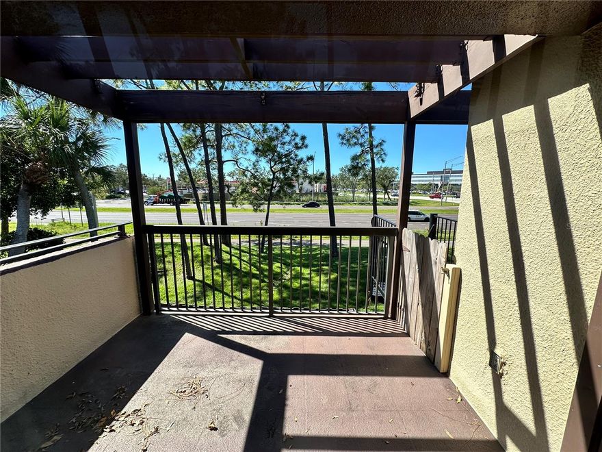 Welcome to this spacious and bright 975 sq. ft. 2-bedroom, 2-bathroom condo located in the desirable Village Lake community. Featuring tile flooring throughout and freshly painted interiors, this move-in ready home is both stylish and low-maintenance. The south-facing windows and sliding doors fill the space with natural light, while the private patio offers outdoor storage and a perfect spot for morning coffee or evening cocktails. Ideally situated directly across from the pool and near abundant guest parking, convenience is key. The HVAC was replaced in 2021 for added peace of mind. Village Lake Condos offer a range of amenities including two swimming pools, tennis courts, a clubhouse, and a car wash station. The community is centrally located just off I-275—minutes from both St. Pete and Tampa downtowns, pristine Gulf beaches, and two major airports. Assigned parking space #235 included. Whether you're a seasonal resident, first-time buyer, or looking to downsize, this condo is priced to sell. Schedule your showing today!