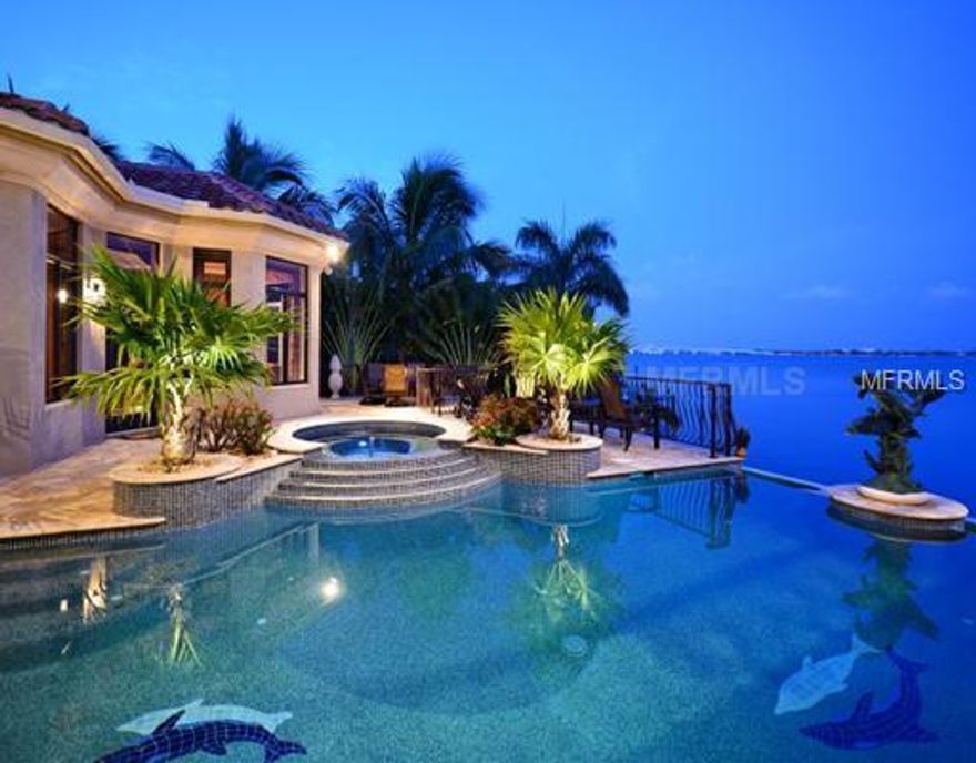 The WOW Factor! Inside and Outside! Enjoy a distinguished ambience and superb privacy from your SPECTACULAR BAYFRONT HOME, ONE OF THE BEST PANORAMIC VIEWS IN SARASOTA. This home was built in 2009 and has almost 8,000 square feet of grand living space withan outstanding peid-a-terre.    Beyond what you would expect in a home of this distinction, the features include a "wellness fitness center with dry and wet saunas, special flooring and an extensive workout room.  There is a state of the art "Control 4"system to control lighting, security, home theater, music, and home temperatures either on location or remotely. Wine connoisseurs...look no further for one of the best wine cellars in any private residence, for your sophisticated collection.  The outstanding study has a balcony library, child's hide-away bedroom and a second office sitting room adjacent to the master suite.  TWO POOLS!  Picture perfect infinity pool with spas and the lower level pool with an impressive mosaic design to impress any artist.  The two garages will accommodate 6 vehicles and the boat dock has two lifts and 2 Jet Ski lifts.   This is your own sanctuary of enviable proportions. HOME OWNER'S IN LIDO SHORES HAVE THE OPTION OF BELONGING TO THE HOME OWNER ASSOCIATION FOR $200 PERYEAR FOR ACCESS TO THE DEEDED BEACH LOCATED ON WESTWAY.