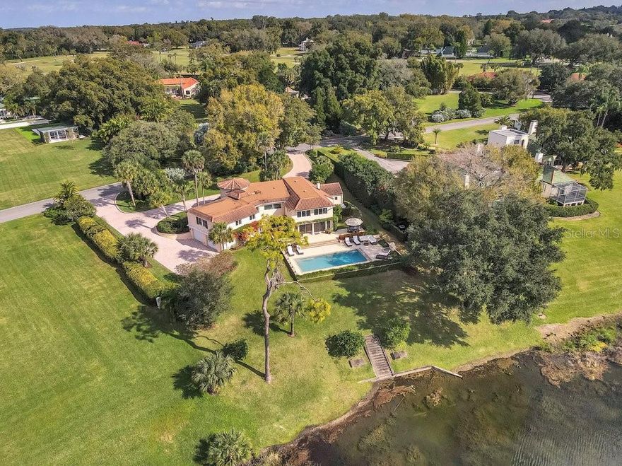 Originally built in 1920 by the renowned Olmstead Brothers, this beautiful Spanish-style home has been fully restored and updated and features four bedrooms with four full and one half baths under 4,337 square feet of air-conditioned living space. The home is bright and cheery with a completely updated kitchen with all modern appliances and amenities. Open to the kitchen is the dining room and great room, all with large windows allowing for lots of natural light and boasting amazing views of the waterfront and 18th tee. The master suite, which also offers amazing waterfront views, includes his and her walk-in closets and beautiful updated master bath with soaking tub, separate shower and double vanities. Just off the master is the office complete with two built-in work stations and laundry. Additional updates include: all new windows and doors, lighting and flooring throughout, wiring and plumbing have been replaced and new pavered circle driveway. This home is a pleasure to show. Call today for your private viewing.