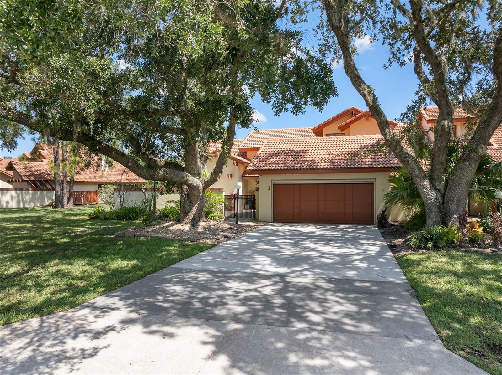 This exceptional end-unit townhome is strategically located on the 13th green of Pine Lakes Golf Club, offering both scenic views and a serene living environment. The property features a completely redone paver patio, ideal for outdoor relaxation and entertainment.
Inside, the home boasts an updated kitchen equipped with recessed lighting, a farmhouse sink, two lazy Susans for optimal storage, double flatware drawers, built-in garbage cans, and soft-close drawers, ensuring both functionality and modern appeal with the master bedroom conveniently located on the main floor, with its own bathroom and large shower. There is a ½ bath, located just off the dining room. Two additional bedrooms and full bath are located on the second level. The bathrooms have also been updated to enhance convenience and style.The property is equipped with two air conditioning units, both only 6 years old, ensuring efficient climate control. The roof was replaced just 3 years ago, and the garage door and patio screens have also been upgraded, reducing future maintenance concerns.The HOA covers all exterior maintenance & landscaping, providing a low-maintenance lifestyle.