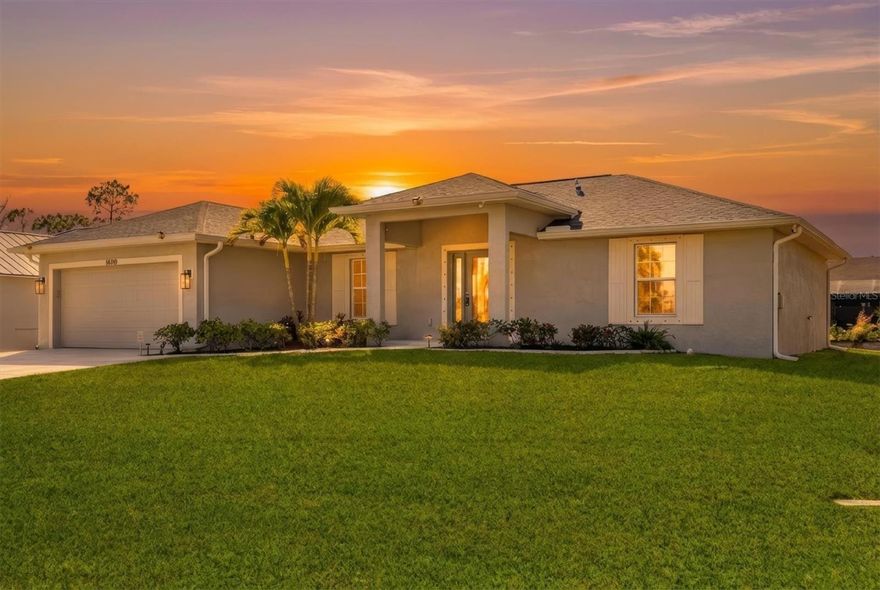 Welcome to this beautifully designed 2021-built single-family home located in the sought-after Port Charlotte community. This spacious 3-bedroom, 2-bath residence offers approximately 1,639 sq. ft. of well-planned living space with an open, functional floor plan ideal for both everyday living and Florida-style entertaining.NO HOA OR CDD!

Step inside to soaring cathedral ceilings, tile flooring throughout, and abundant natural light that enhances the open living area. The well-appointed kitchen features a large center island, granite countertops, stainless steel appliances, and seamless flow into the dining space—perfect for family meals or hosting guests. Additional features include a home water filtration system and a 6-camera surveillance system for added comfort and peace of mind.

The primary suite serves as a private retreat with a walk-in closet and en-suite bathroom. Two additional bedrooms and a second full bath provide flexibility for family, guests, or a home office. Hurricane/storm shutters, recessed lighting, and ceiling fans in every room add convenience and security.

Enjoy outdoor living with an enclosed lanai overlooking a canal-front setting, all situated on a generous 9,999 sq. ft. lot in the established Port Charlotte Sec 058 neighborhood. PUBLIC WATER & PUBLIC SEWER add to the home’s appeal, while a 2-car attached garage and modern construction complete this move-in-ready property.

Located near shopping, dining, parks, and local waterways, this home offers the perfect blend of modern design and relaxed Florida living.Conveniently located just minutes from Boca Grande, offering access to world-class fishing, dining, shopping, and Gulf beaches. This property truly captures the best of Florida living.