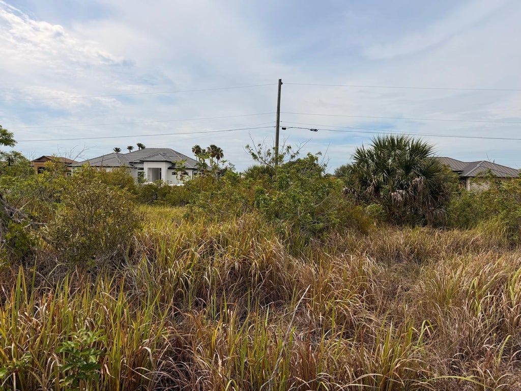 Photo of 15229 Aquarius Circles, Port Charlotte, FL 33981 (MLS # TB8550413)