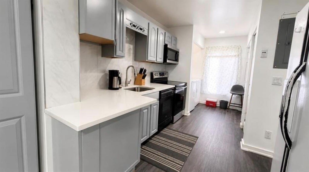 Photo of 5304 Indian Creek Drive #D03, Orlando, FL 32811 (MLS # O6438502)