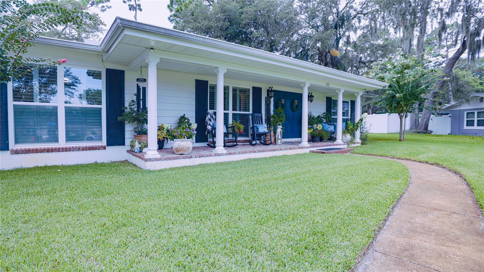 Remodeled! 2BR/2BA with XL Garage, Oversized Vinyl Fenced In Yard, Screened In Spacious Back Porch with ceiling fan, Fabulous pool, and nearly 2000 square ft of living space! Feel like royalty of Kingswood Ct while sitting on the covered and long front porch with a grand view of your whole neighborhood. Discover this beautifully remodeled Sanford gem in a quiet, well-kept cul-de-sac neighborhood near the Lake Mary border, creating privacy, a feeling of safety, and a sense of community. The entire property has been meticulously maintained from the front porch to the gorgeous backyard. As you enter, you’ll find a flex space, currently being used as a living room, that leads to an open layout filled with natural light and a stylish family room with vaulted ceilings, wood burning fireplace, and a spacious dining area. The entire home features wood-look ceramic tile and beautifully Restored Original TERRAZZO flooring! The renovated kitchen boasts sleek granite countertops, GE Cafe Platinum Glass Induction Range and Hood, modern cabinetry, stainless steel appliances, breakfast bar, and a breakfast nook—perfect for everyday living, incredible dinner parties, and entertaining. Both bathrooms have been tastefully updated with modern fixtures and finishes. The house has a convenient split plan providing needed privacy and space. The air conditioned laundry room is located inside, between the kitchen and the garage. Step outside from the Kitchen or Family Room's French Doors to a spacious, screened-in back porch that offers the perfect spot for morning coffee, movie nights, or evening unwinding, overlooking your sparkling volleyball designed pool and the large back yard ideal for pets, play, or more entertaining and relaxation! Additional highlights include, New Hot Water Heater(2024), New A/C unit(2024), New Septic System(2023), updated double paned windows and doors(2020), an oversized garage with room for storage or a workshop, Owl Home Security System, no HOA, and a prime location just minutes from golfing, shopping, dining, and top-rated schools in Lake Mary and Sanford. This is the low-maintenance, high-comfort home you’ve been waiting for. Schedule your private tour today!